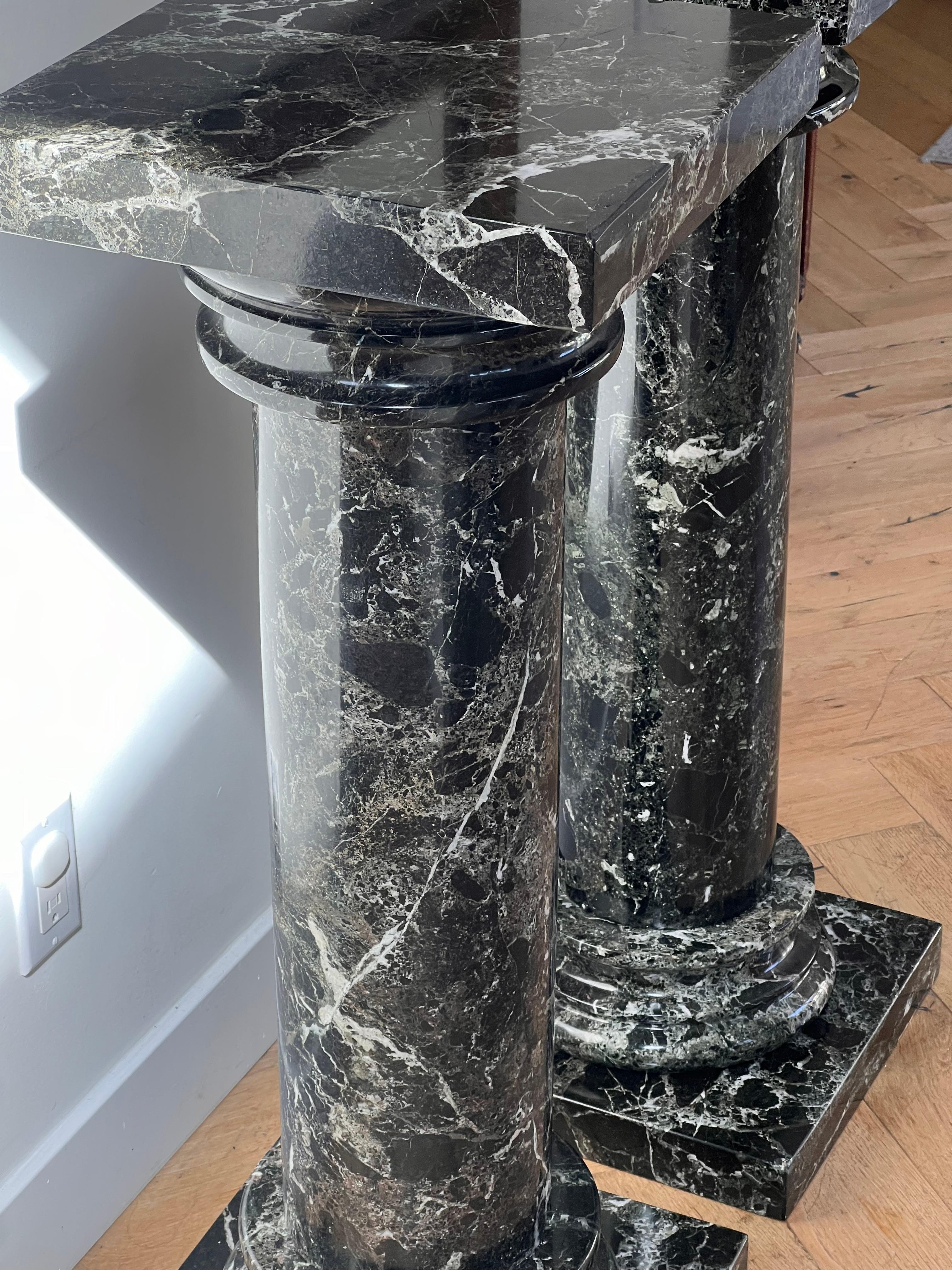 A pair of black marble pedestal columns, late 20th century 5