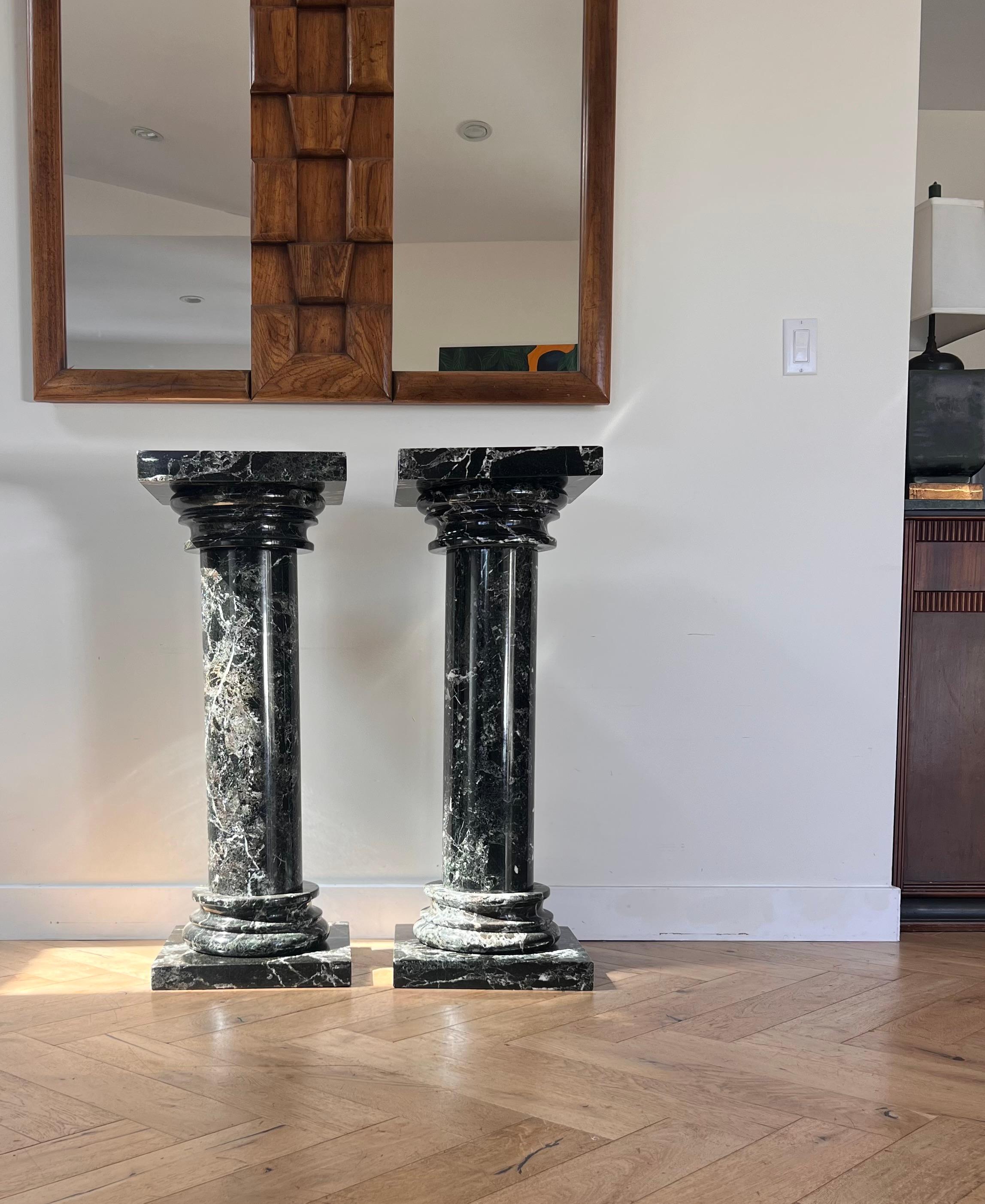 A pair of black marble pedestal columns, late 20th century 11