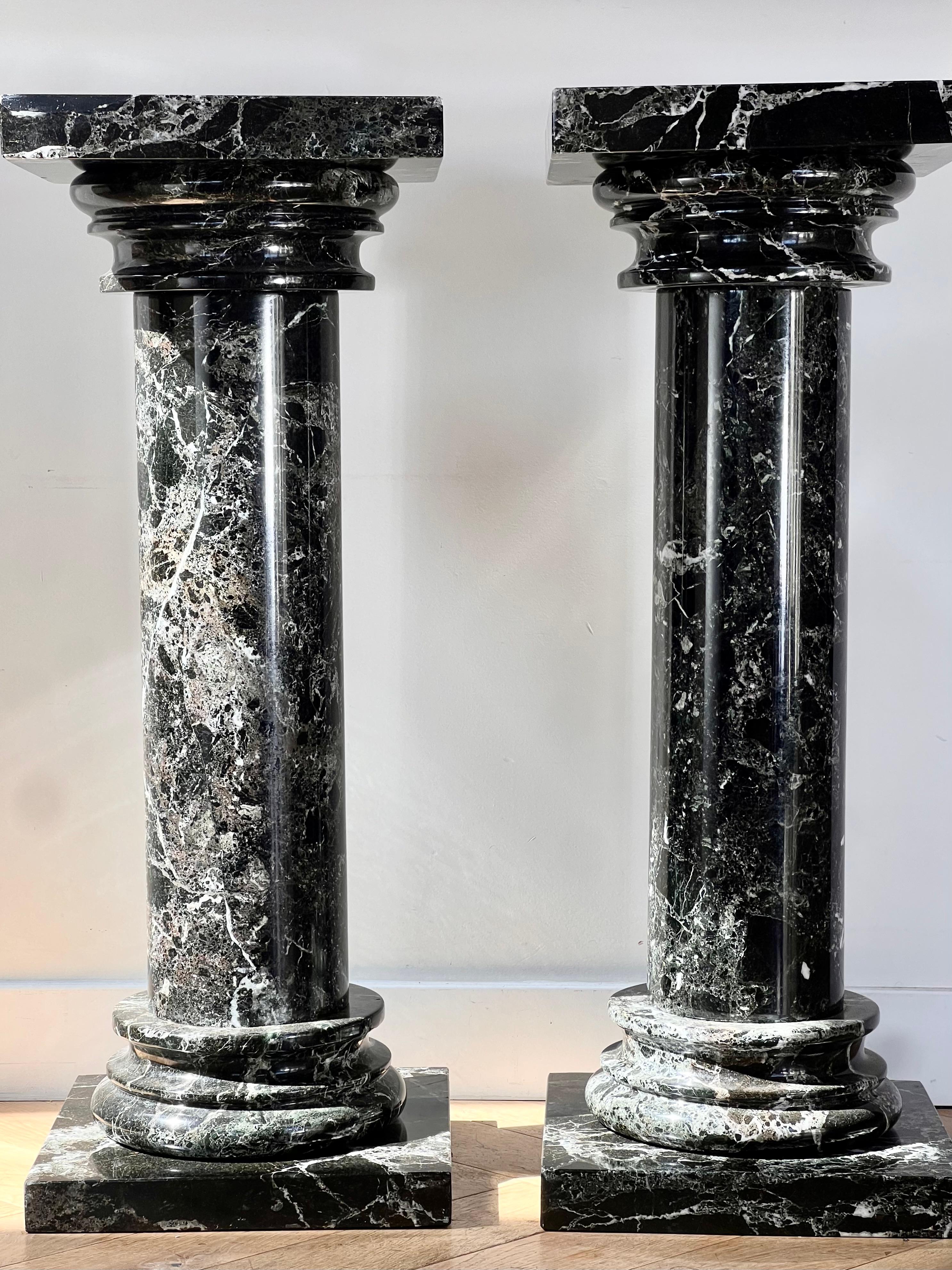 A pair of black marble pedestal columns, late 20th century 12