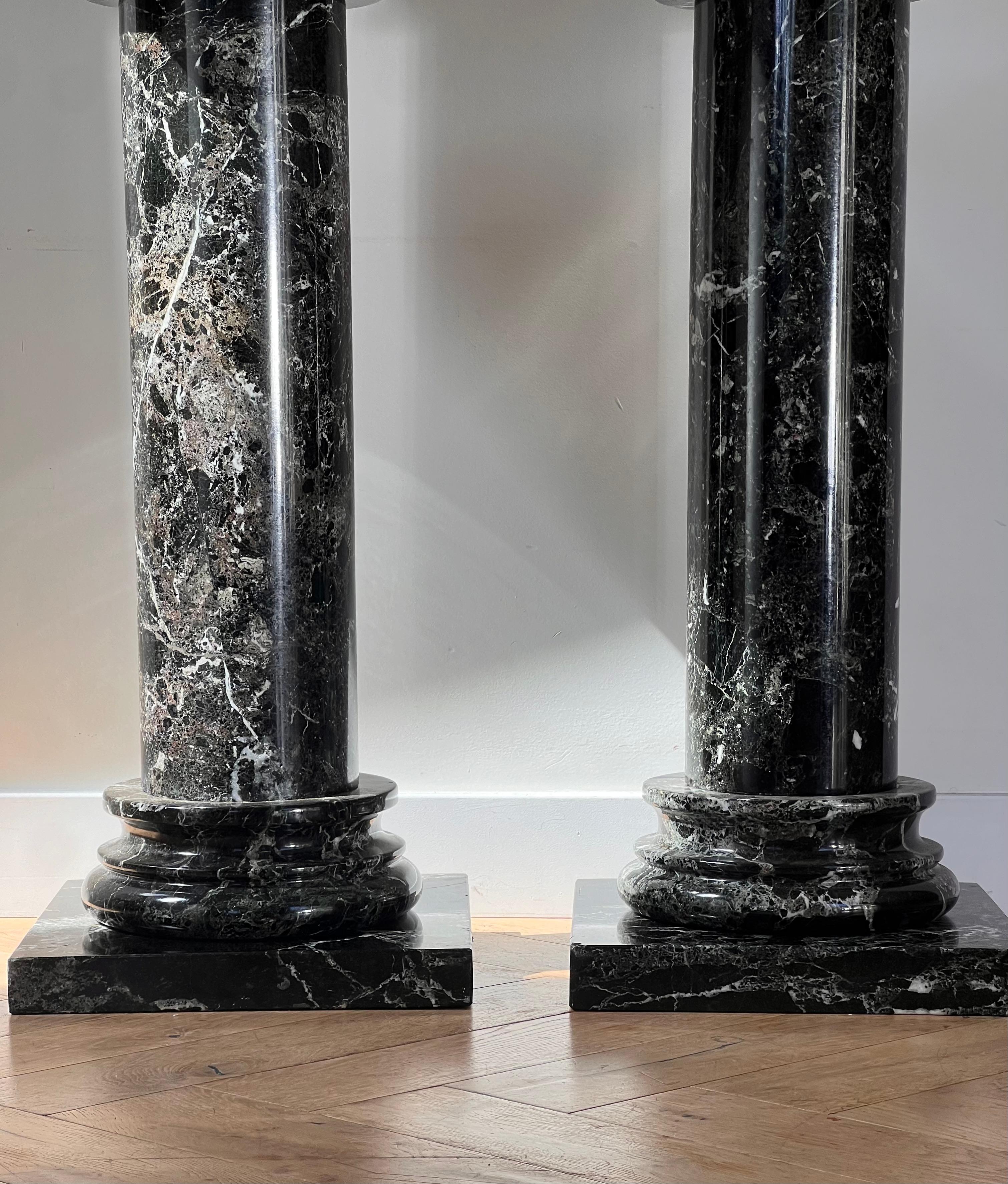 A pair of black marble pedestal columns, late 20th century 13