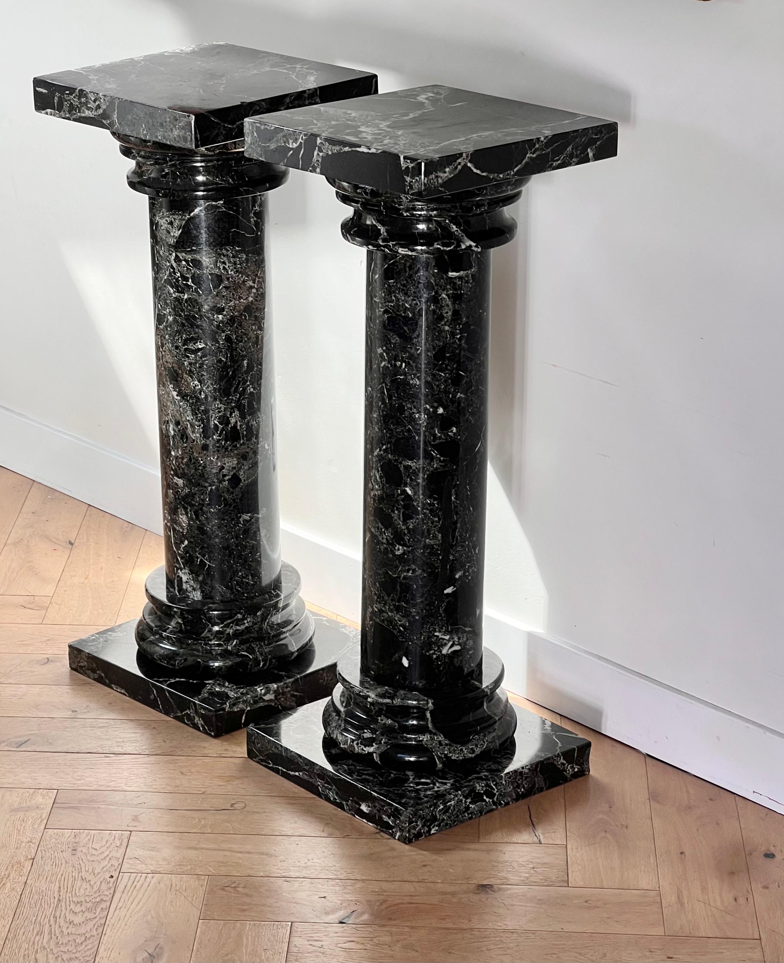 Neoclassical A pair of black marble pedestal columns, late 20th century