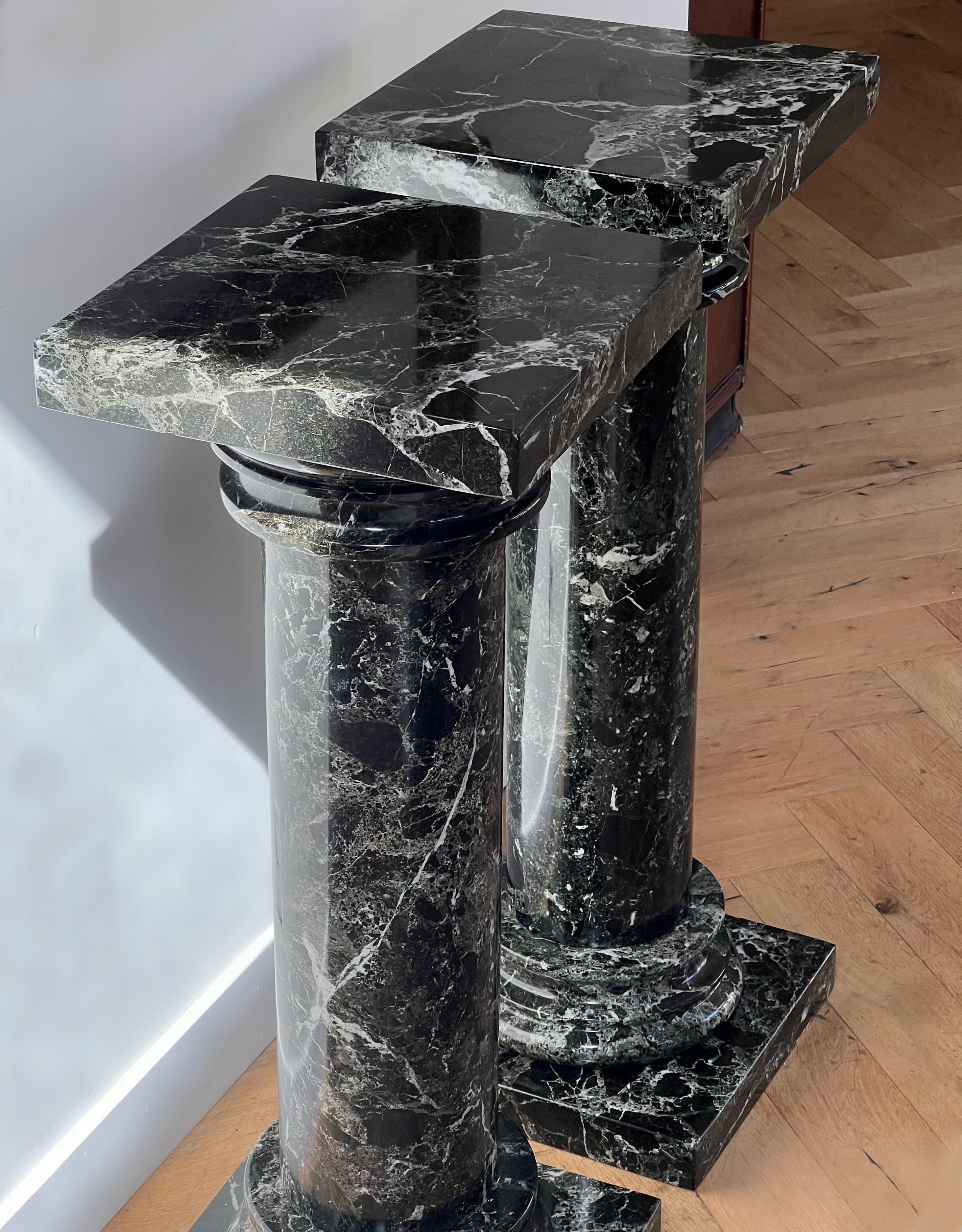 Unknown A pair of black marble pedestal columns, late 20th century