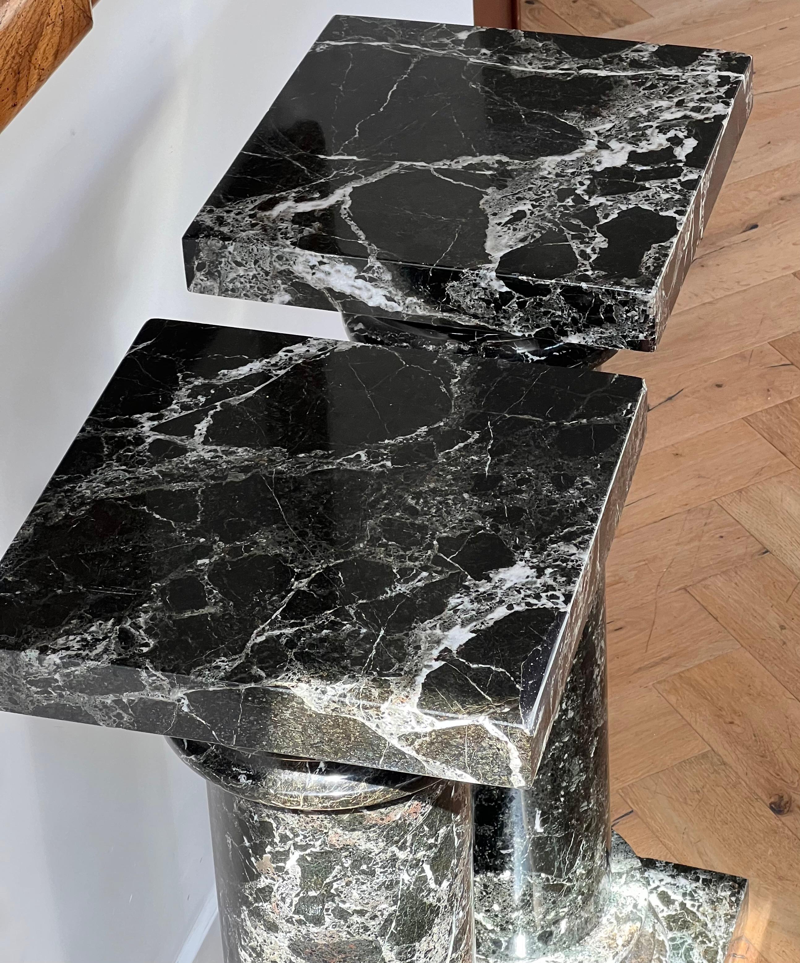 20th Century A pair of black marble pedestal columns, late 20th century