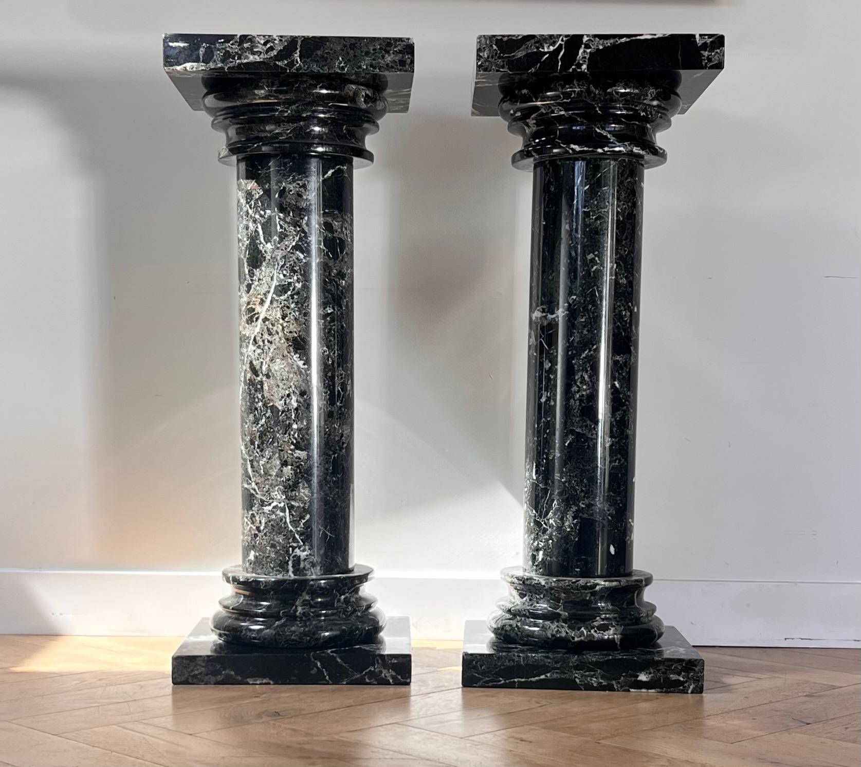 A pair of black marble pedestal columns, late 20th century 2