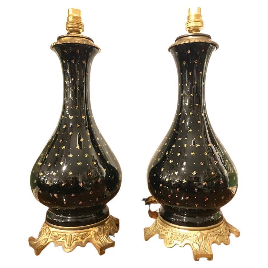 Pair of Black Porcelain Lamps on Ormolu Bases with Gold Star Detailing For Sale