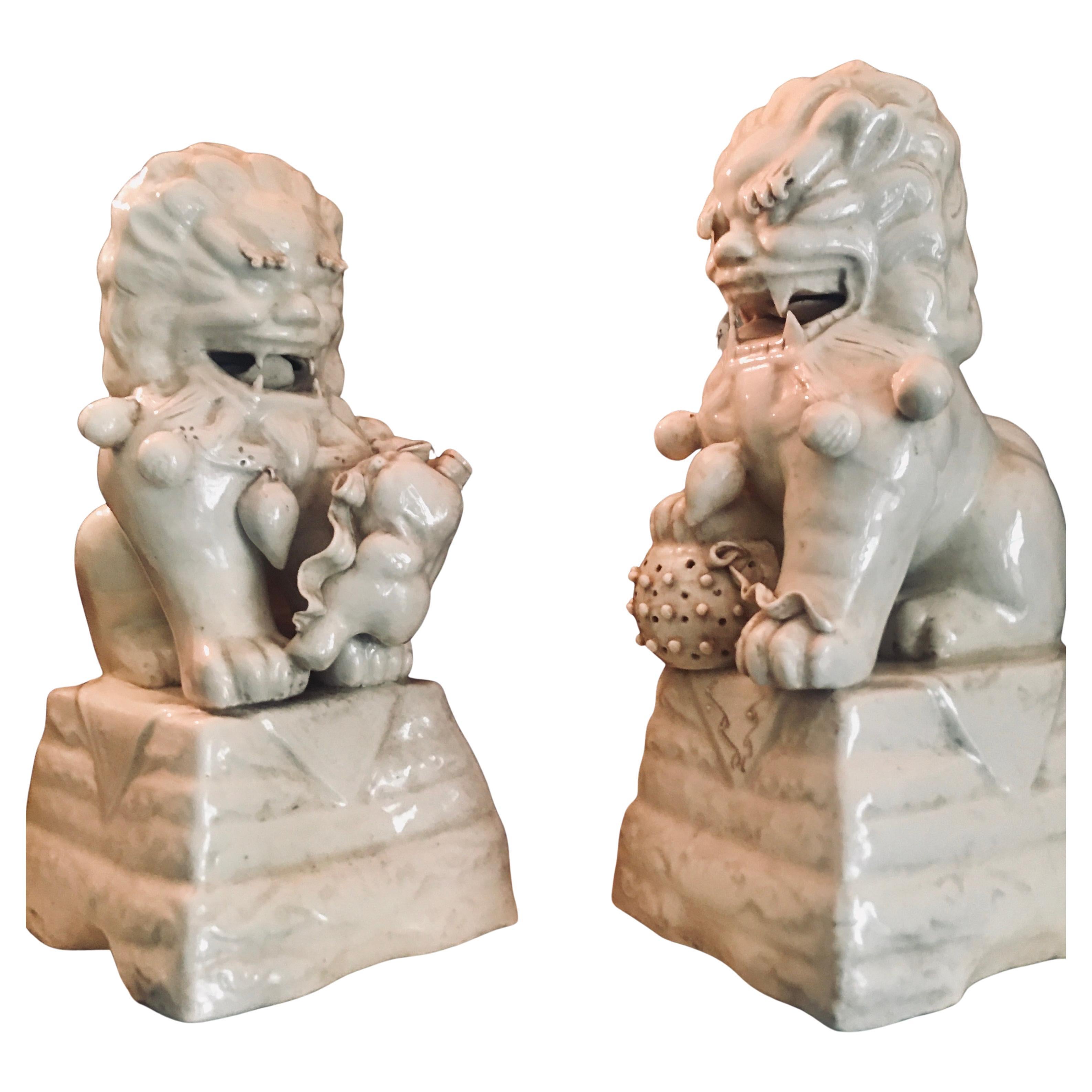 A Pair of Blanc de Chine Ceramic Foo Dogs, Ca. 1840