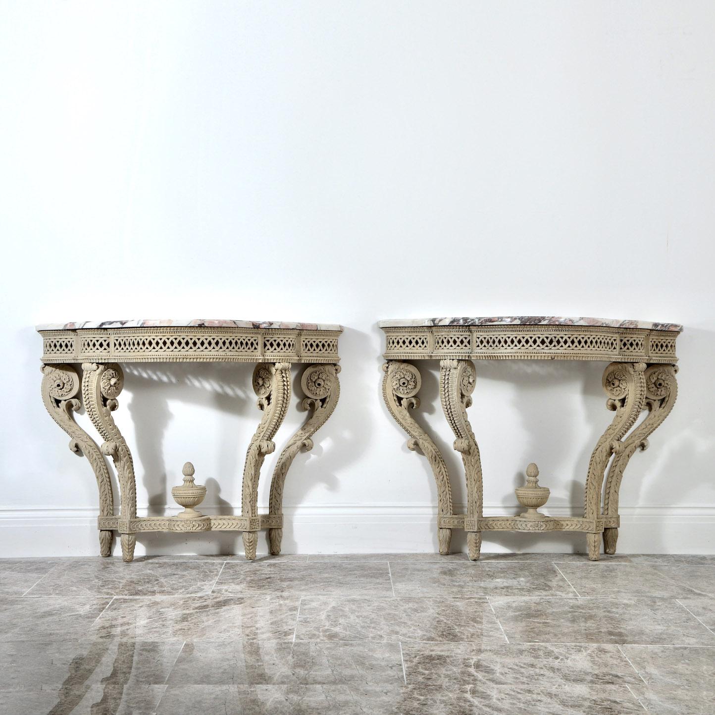 A pair of bleached oak console tables

France, Circa 1900

” Incredibly well carved pair of oak consoles, bleached and washed back to soft, powdery pale oak, with their original Breccia marble tops “.