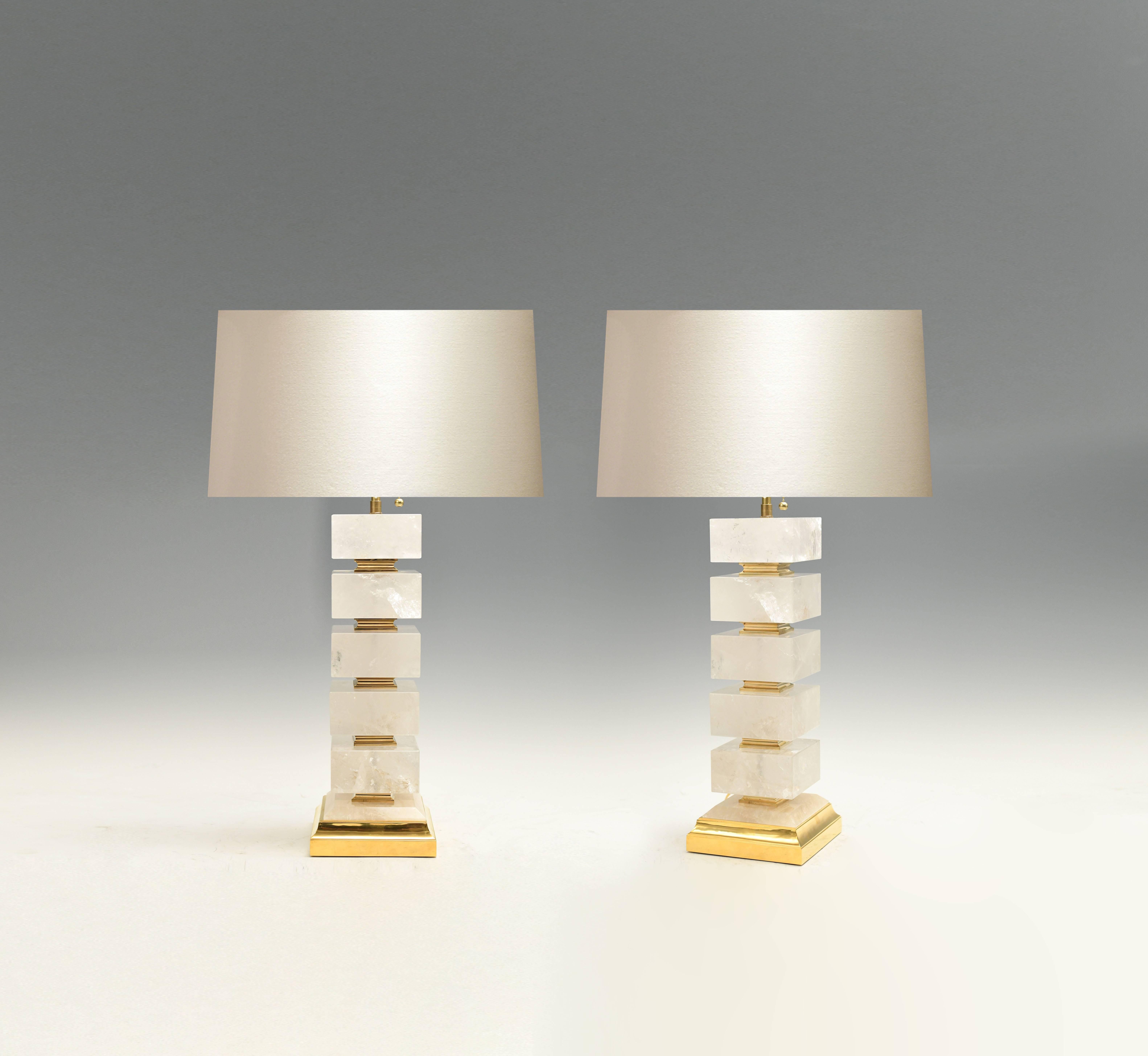 A pair of the block from rock crystal lamps with polish brass base and inserted decoration. By Phoenix Gallery NYC.
Measure: 18.25 H to the top of the rock crystal.
 