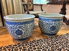 A pair of blue and white 'lotus' jardinières late Qing dynasty, early 20th centu