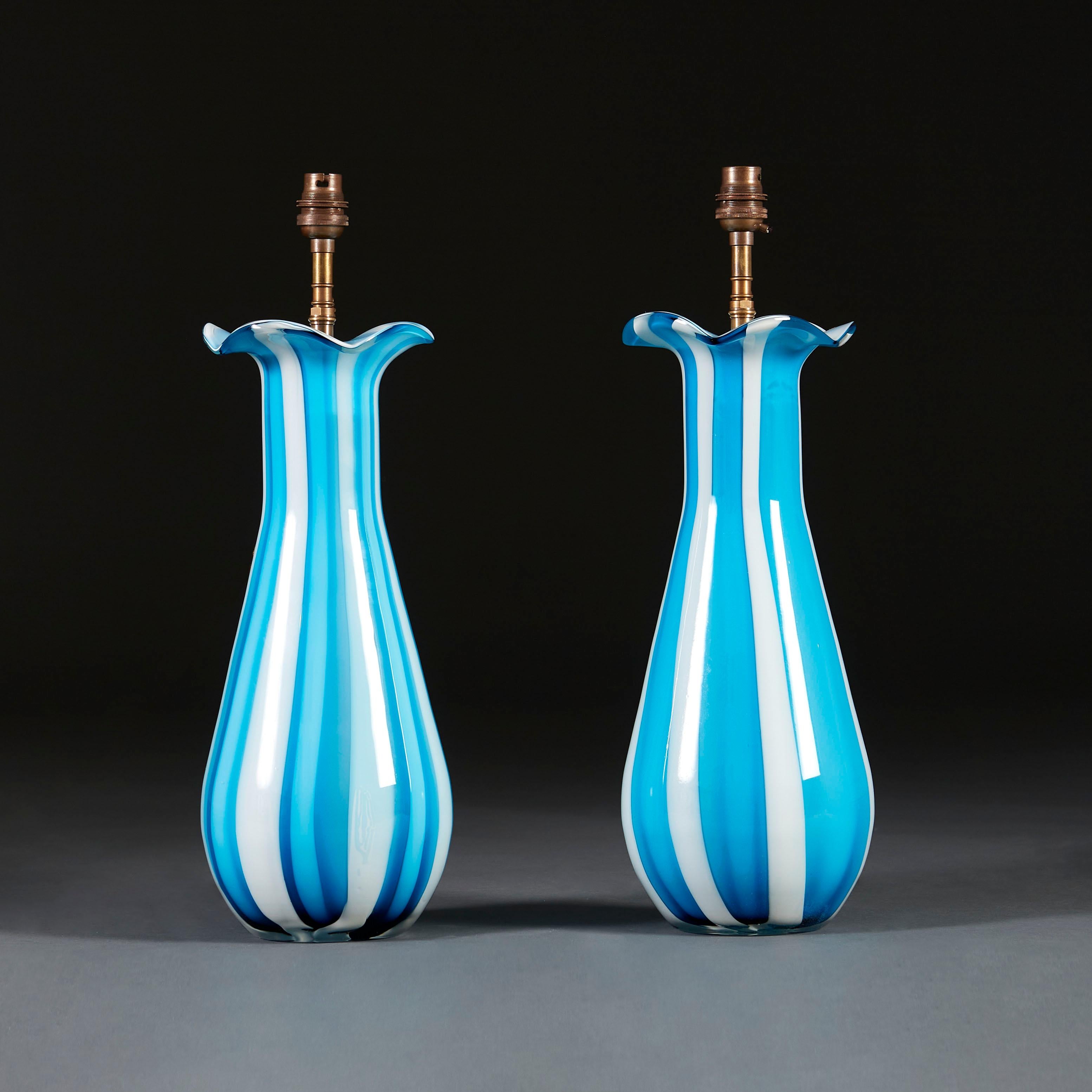 A pair of blue and white striped Murano glass vases with undulating rims, now converted as lamps.