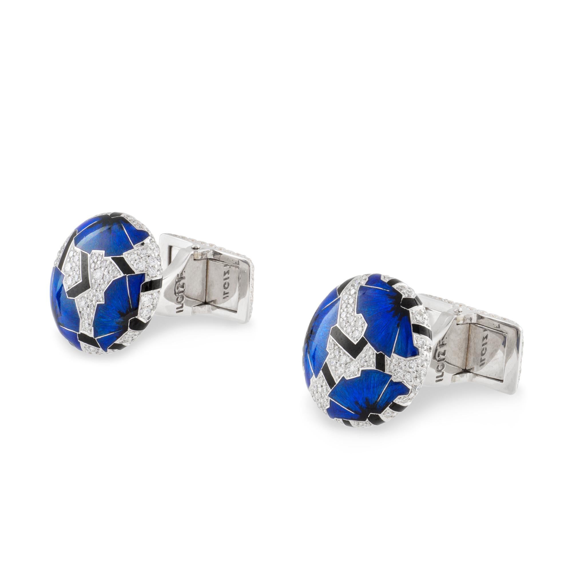 A pair of blue poppies cufflinks by Ilgiz F, each cufflink with three poppies with champlevé enamelled petals and hot enamelled peduncles, on a diamond pave-set background of round shape, all mounted in 18ct gold with diamond-set swivel fittings