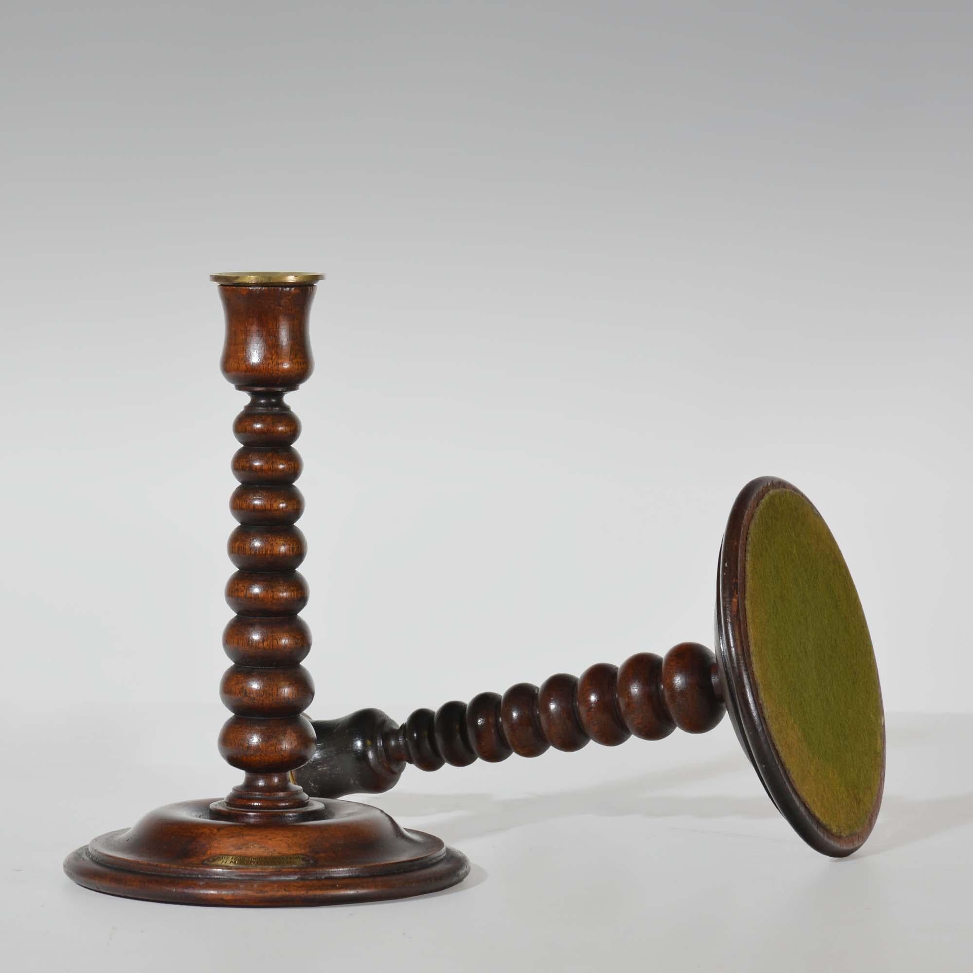 English A pair of bobbin turned teak candlesticks - Royal yacht HMS Renown For Sale