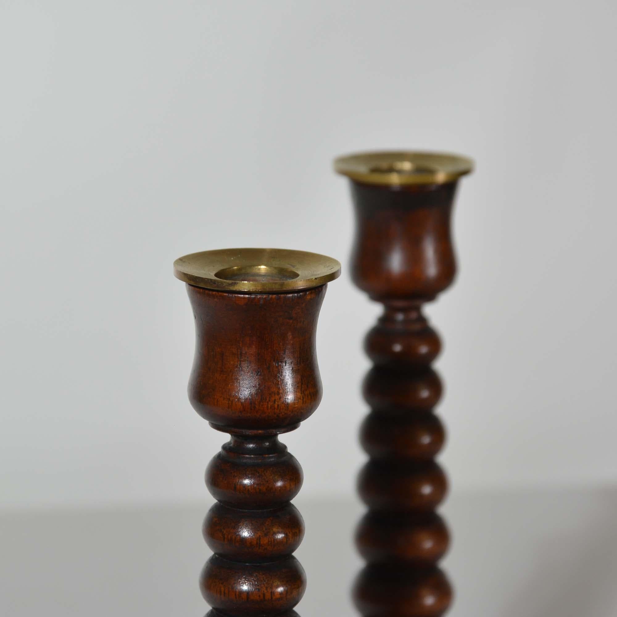 20th Century A pair of bobbin turned teak candlesticks - Royal yacht HMS Renown For Sale