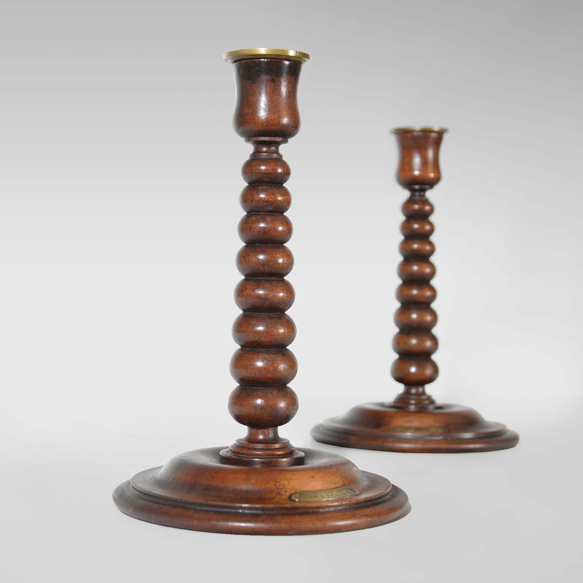 A pair of bobbin turned teak candlesticks - Royal yacht HMS Renown For Sale 1
