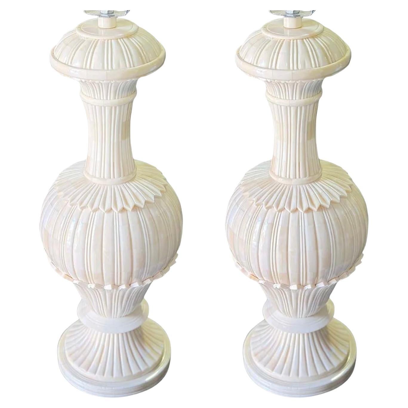 A stylish and interesting pair of table lamps, fabricated in fine bone.
The craftsmanship is apparent, these lamps come from a high
end retail shop.