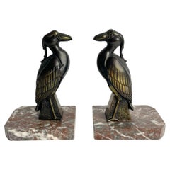 A pair of Bookends with birds signed Jamar in period Art Deco from the 1930s