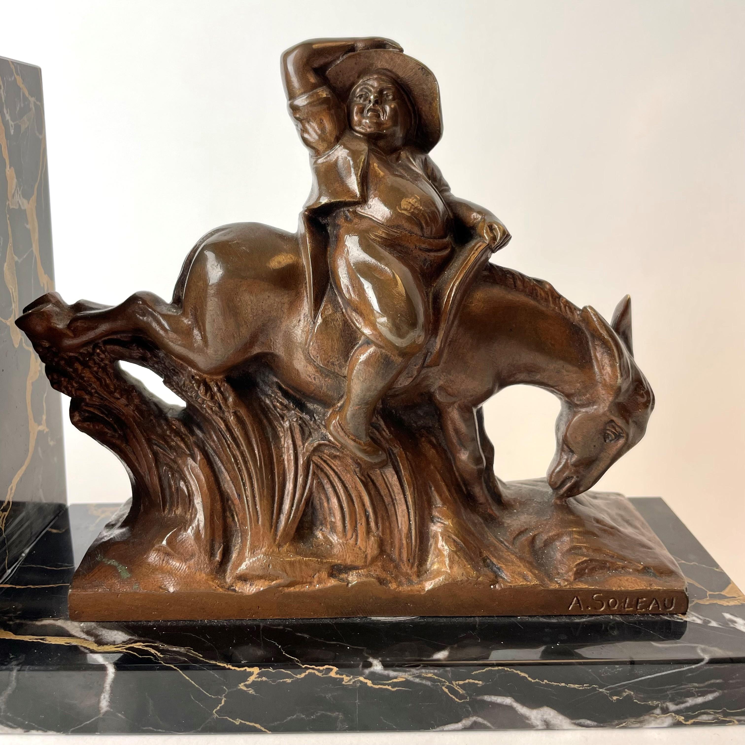 Mid-20th Century Pair of Bookends with Scenes from Don Quixote, Signed A. Soleau.