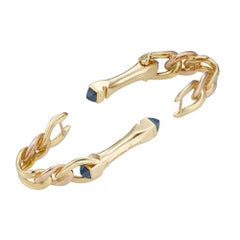 A pair of Boucheron gold and sapphire stirrup cufflinks