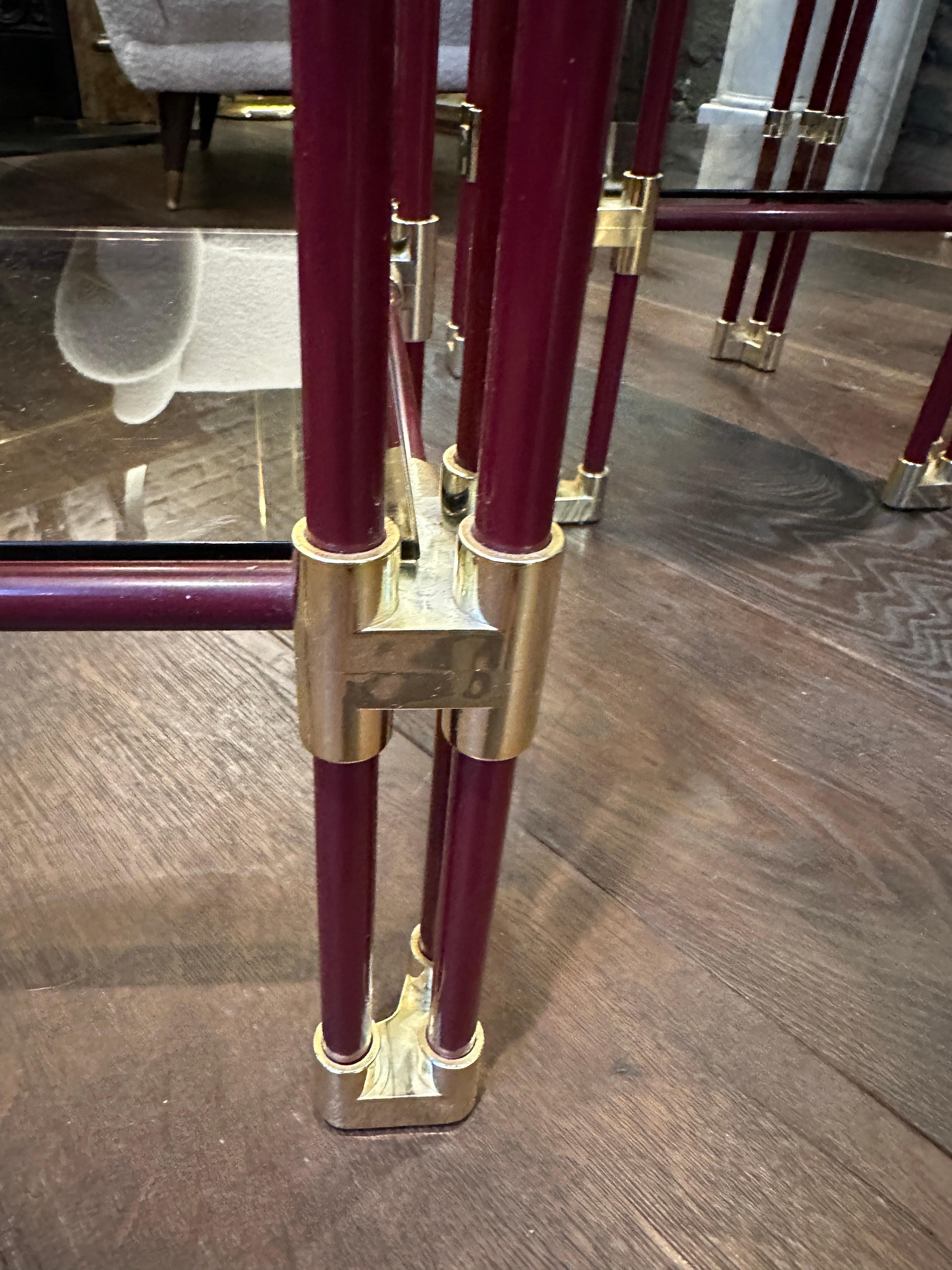 Hollywood Regency A Pair Of Brass and Burgundy Lacquered Two Tier Side Tables 