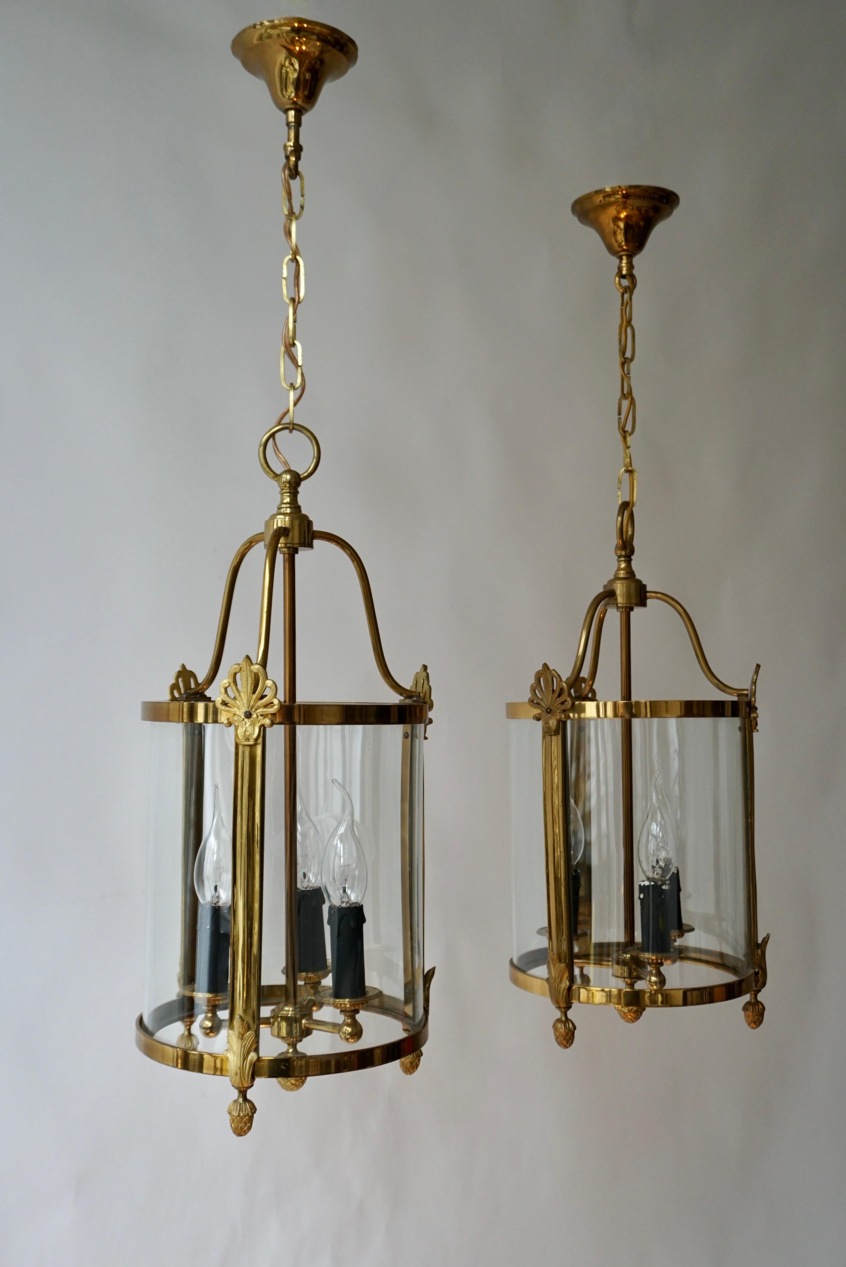 Italian A Pair of Brass and Glass Three Light Lanterns For Sale