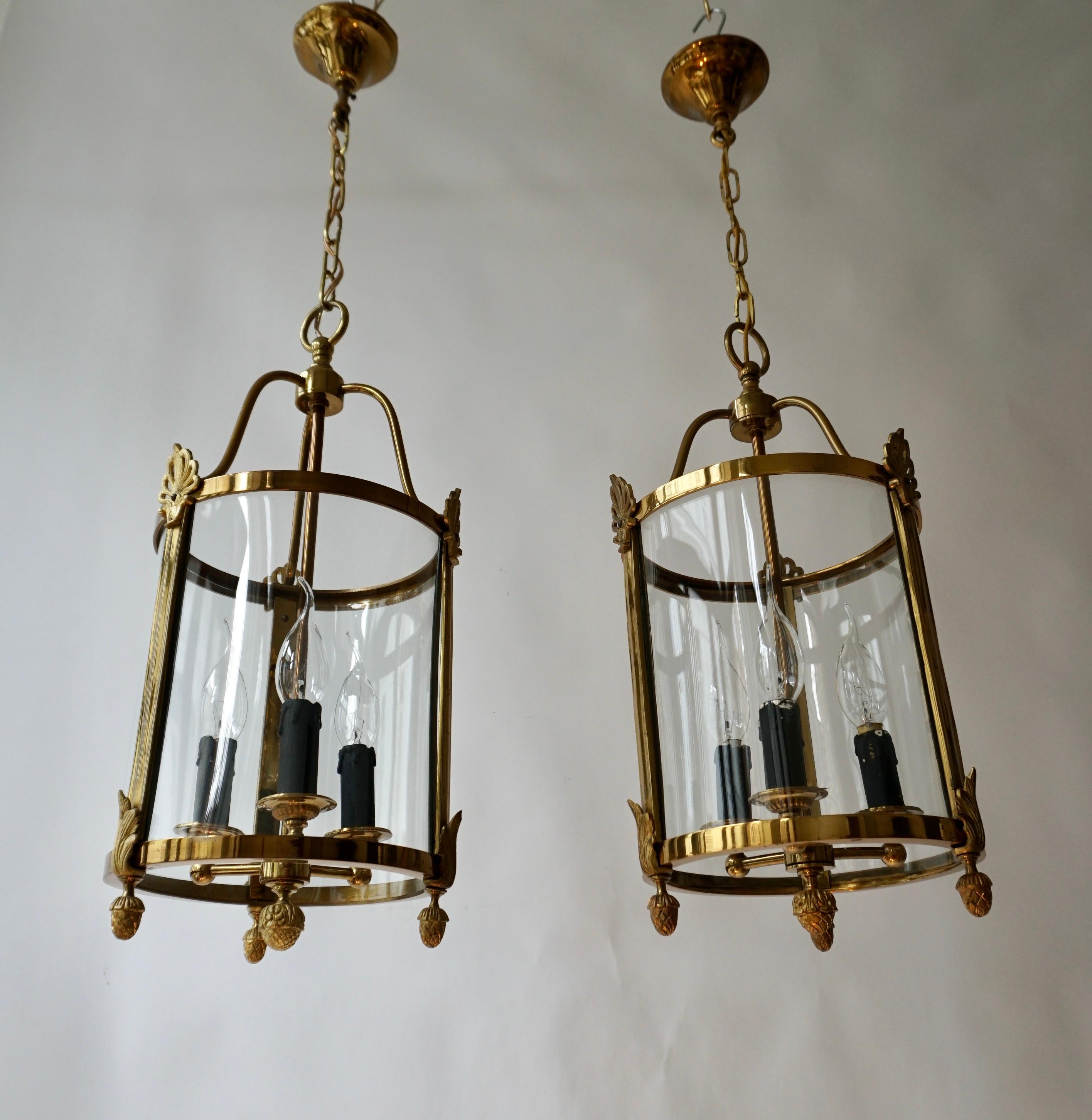 A Pair of Brass and Glass Three Light Lanterns In Good Condition For Sale In Antwerp, BE