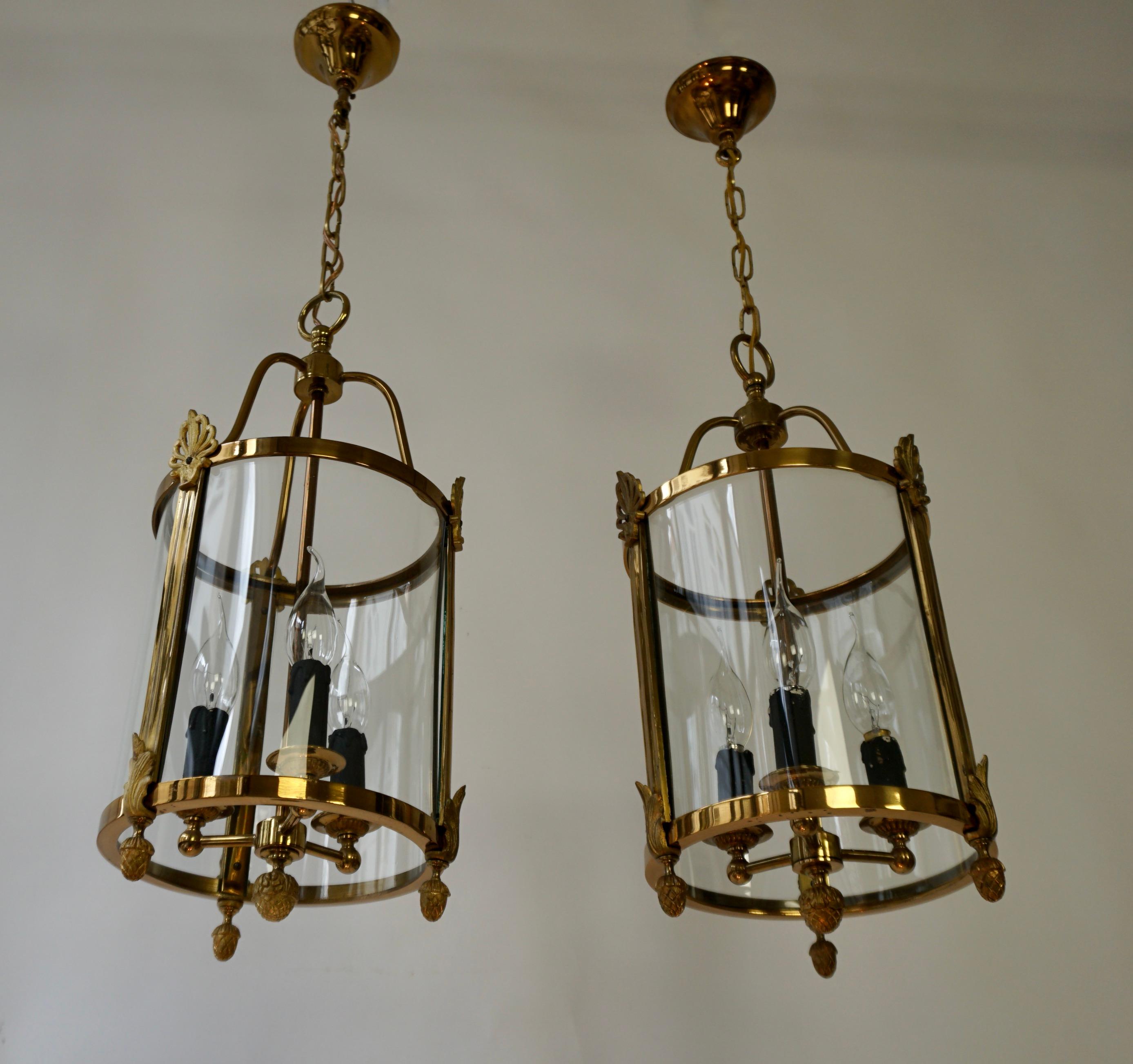 20th Century A Pair of Brass and Glass Three Light Lanterns For Sale