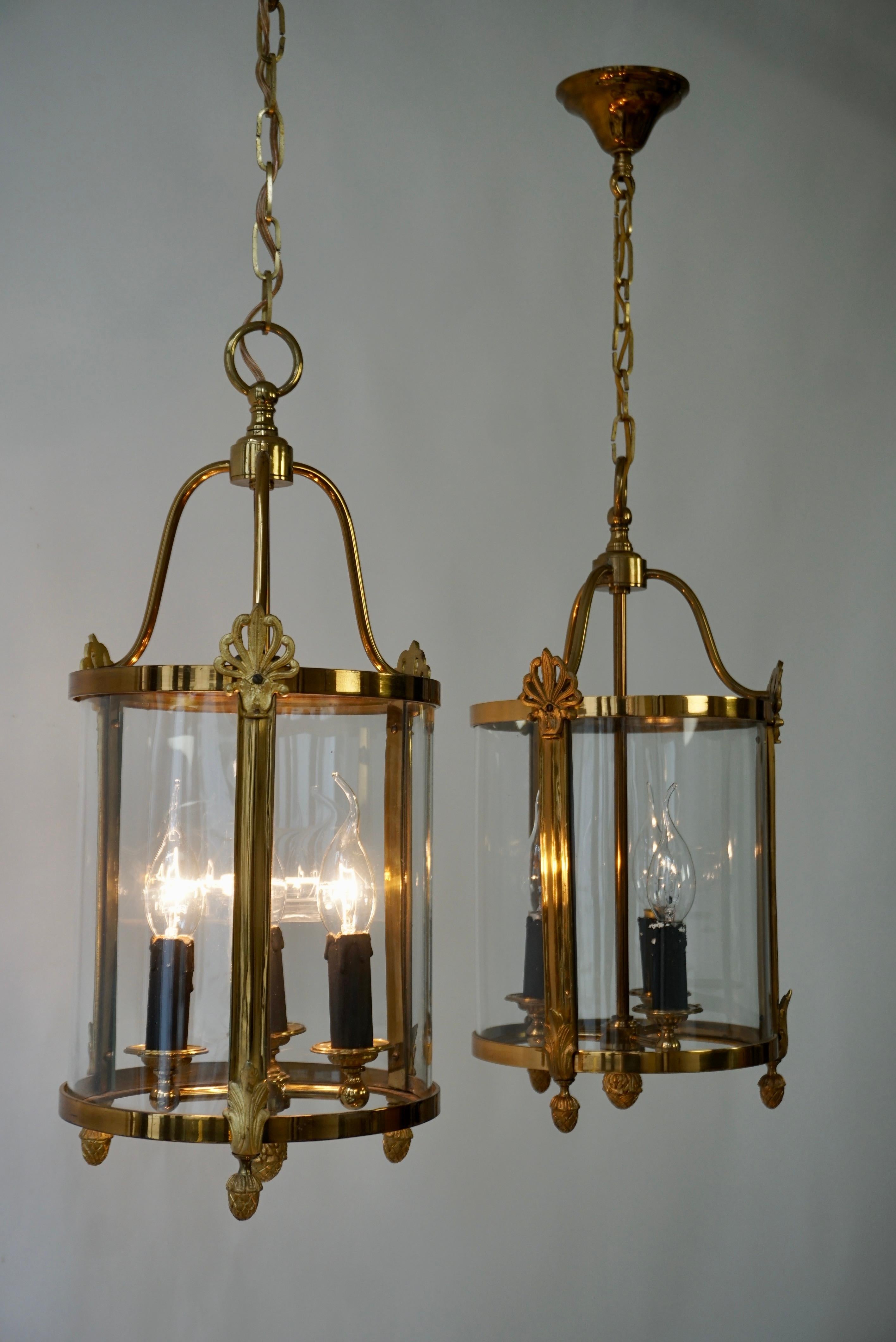 A Pair of Brass and Glass Three Light Lanterns For Sale 1