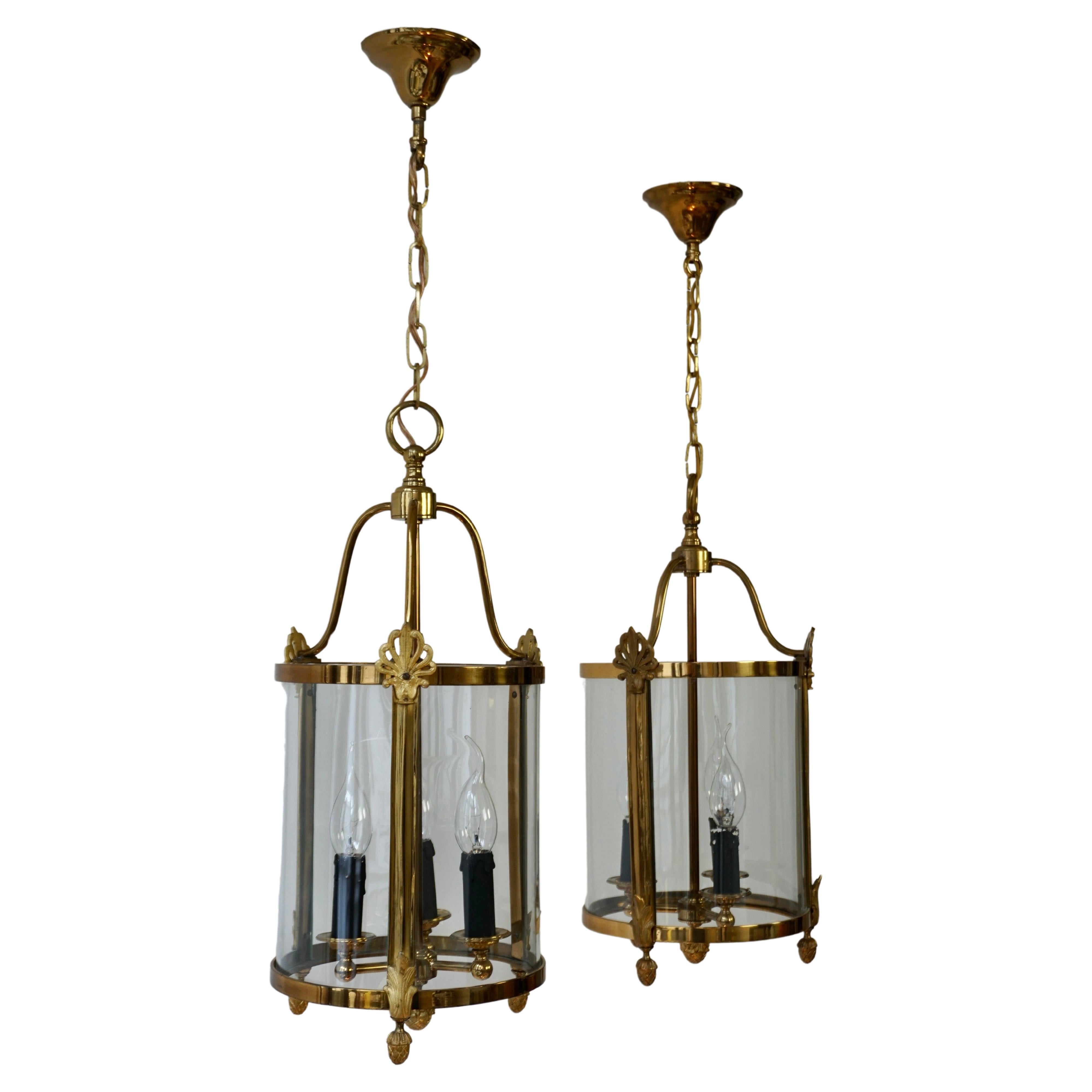 A Pair of Brass and Glass Three Light Lanterns For Sale