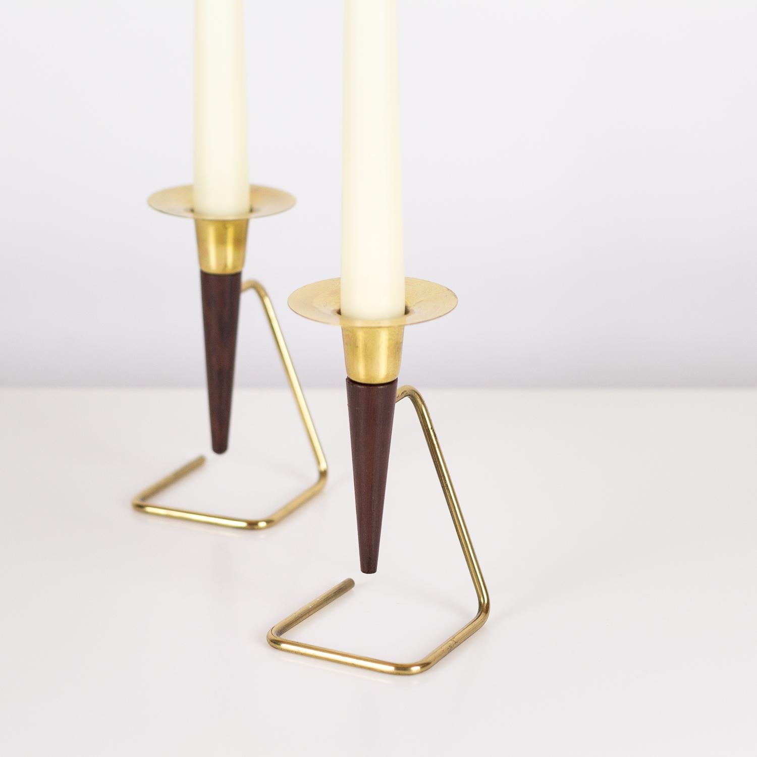 A pair of 1960s Danish brass and rosewood midcentury candlesticks in great vintage condition.