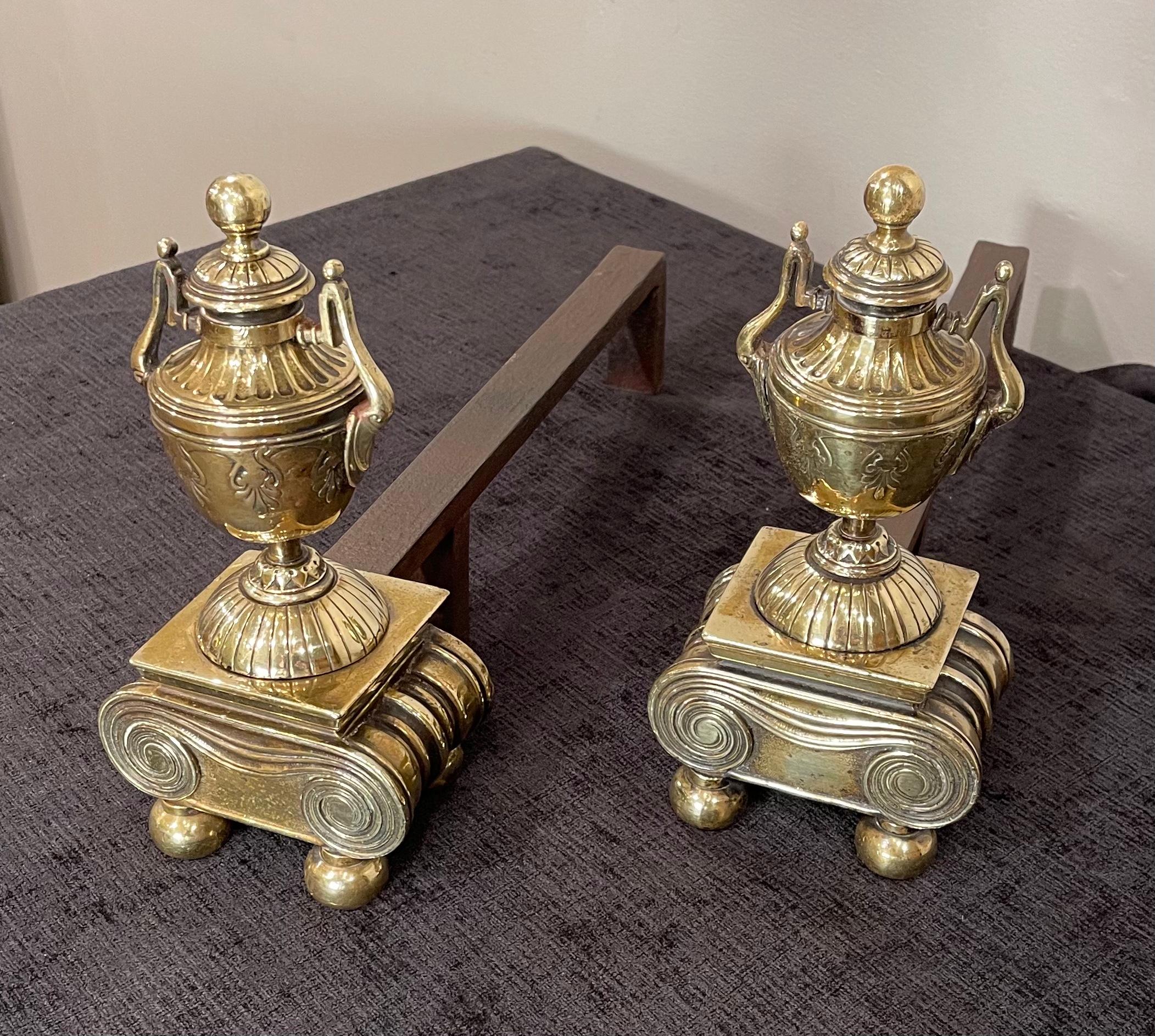 A Pair of Brass Andirons, of diminutive proportions

Urn form, raised on scrolled base with Brass ball feet 

Tightened cleaned & polished.
