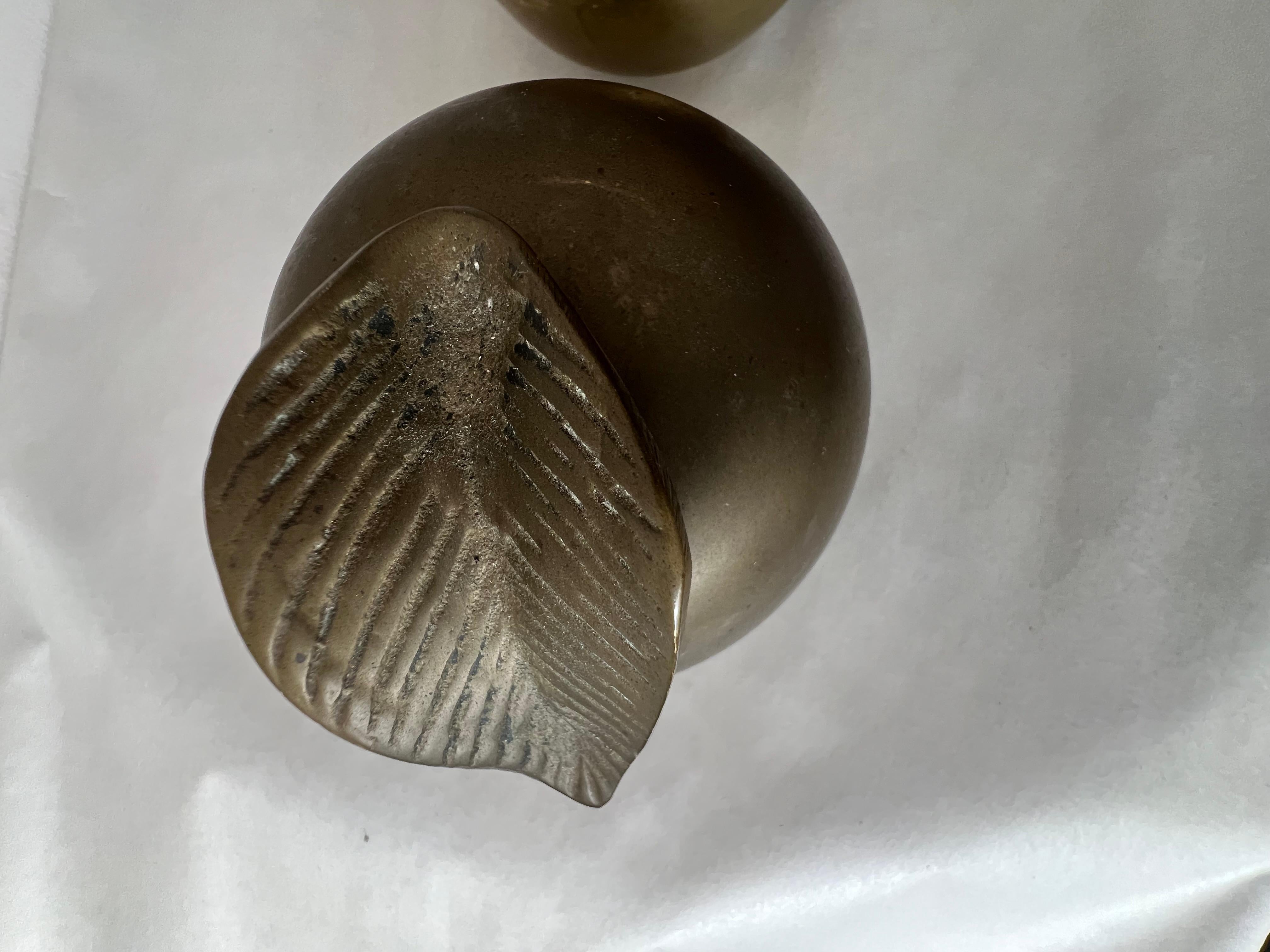 A pair of vintage, patinated, brass apple sculptures. Heavy and well made, one retaining a label.