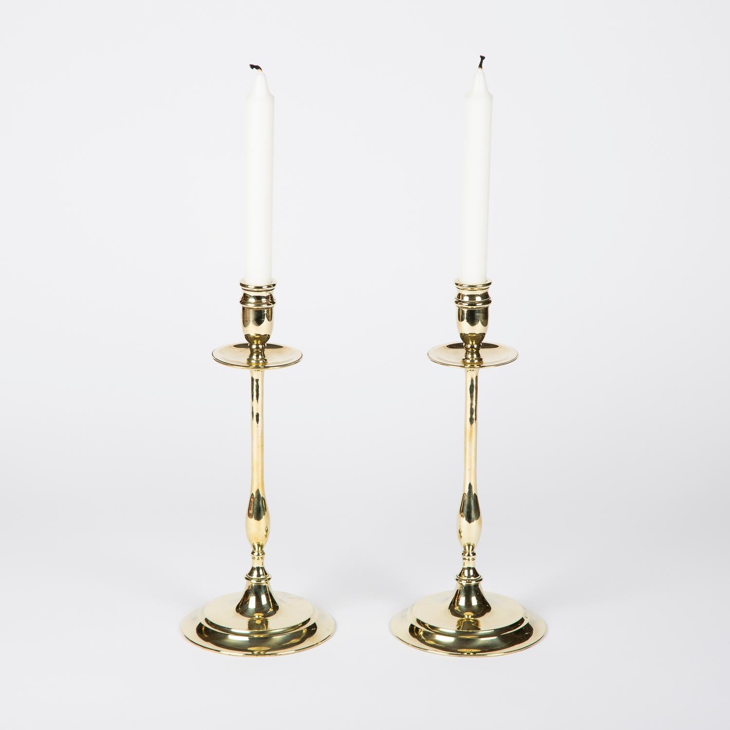 A pair of brass candlesticks, circa 1900-1910.

Measures: Height 31 cm.

Diameter 13.5 cm.