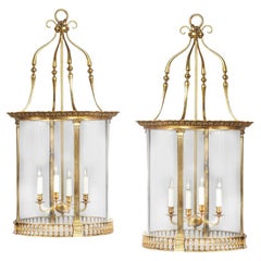 A pair of brass drum lanterns in the style of Lutyens
