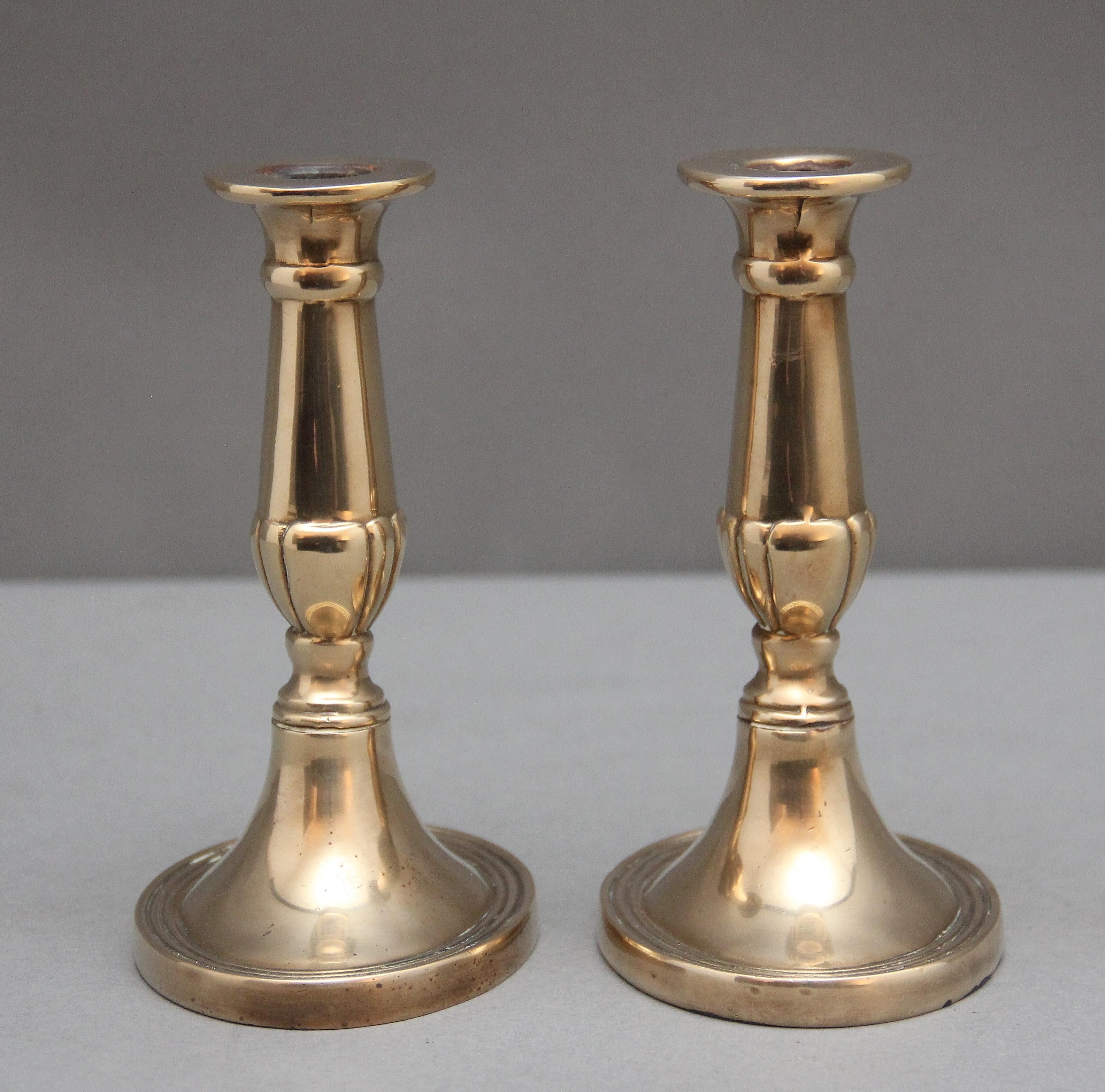 British A pair of brass Georgian candlesticks For Sale