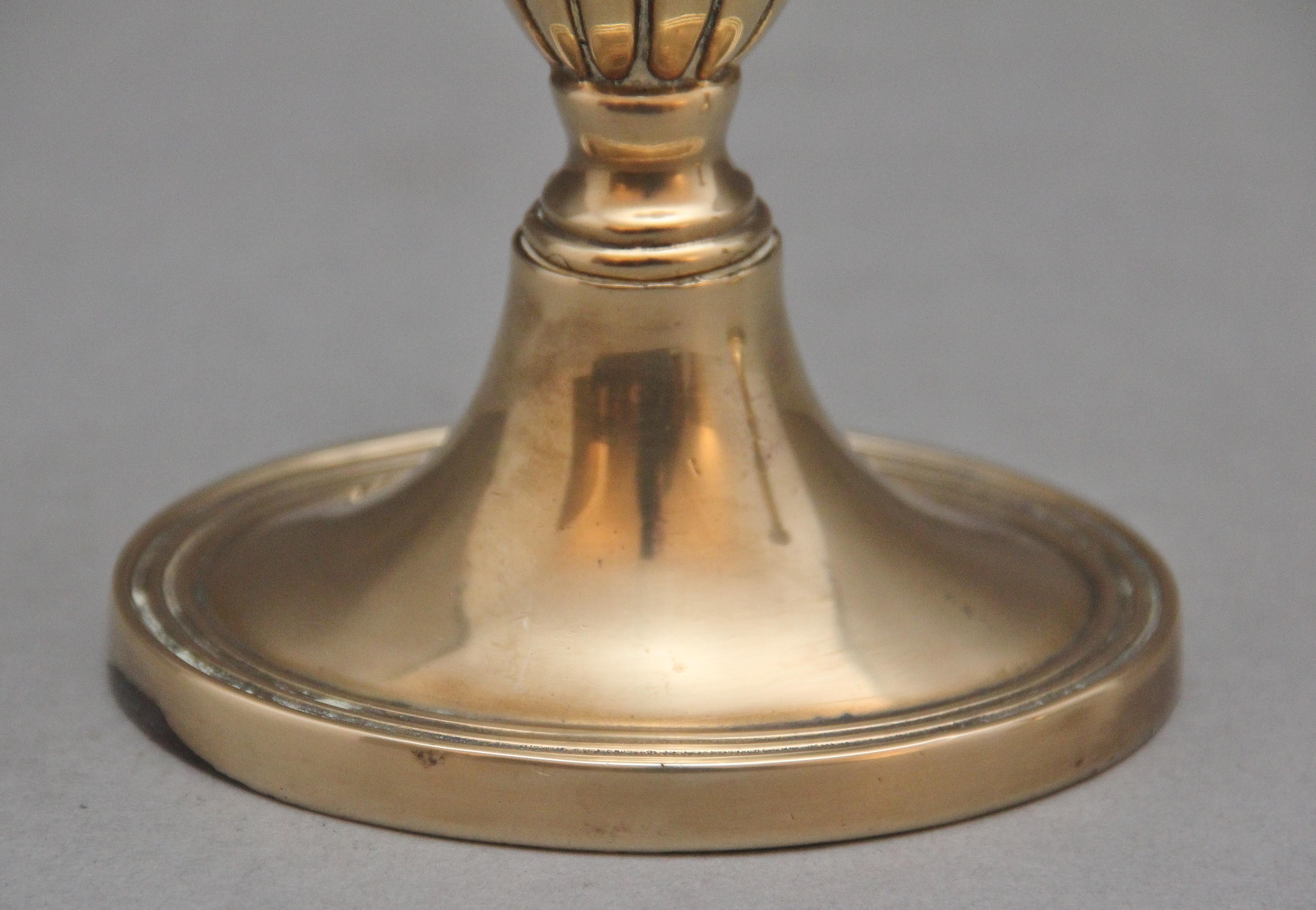 A pair of brass Georgian candlesticks For Sale 1