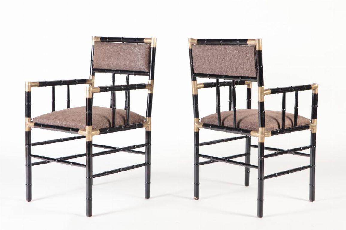 A pair of brass mounted open armchairs in the manner of Billy Haines circa 1950. 