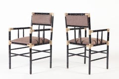 A pair of brass mounted open armchairs in the manner of Billy Haines circa 1950.