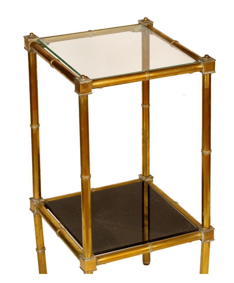 A pair of brass, two-tier smoked glass square tables.