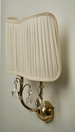 Coppia di lampade da parete in ottone con decorazioni in cristallo, Austria, anni '30