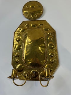 A Pair of Brass Wall Shields, With Two Candleholders. Decorated