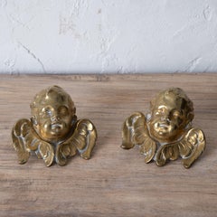 A Pair of Brass Winged Cherub Head Mounts, 19th Century