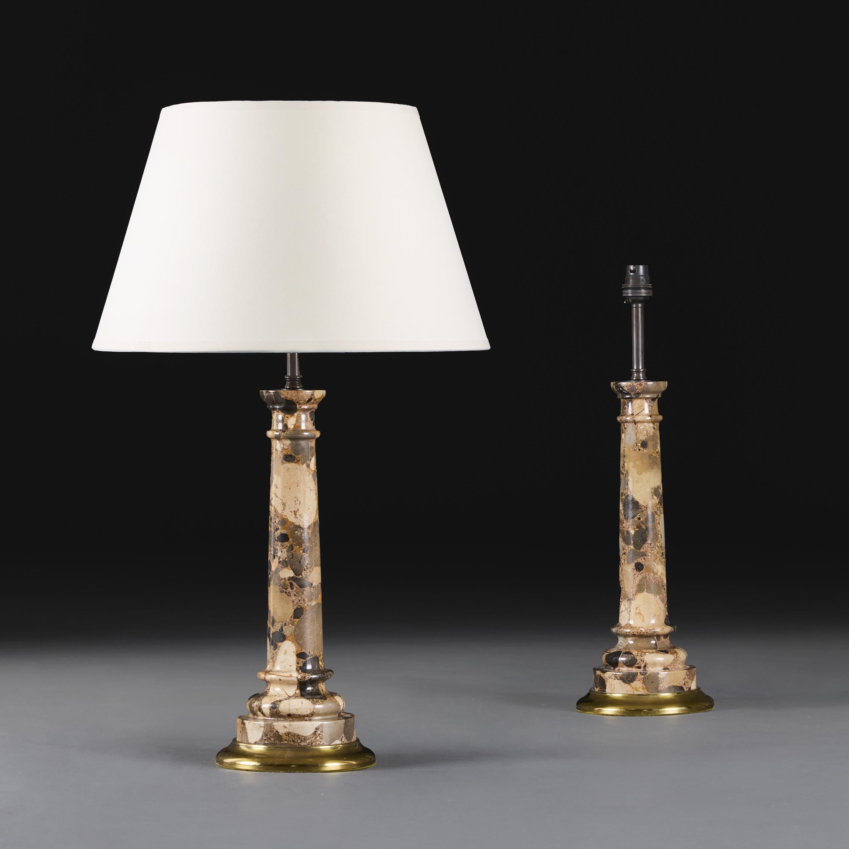England, circa 1940.

A pair of twentieth century turned breccia marble column lamps, mounted on brass bases.

Height 35.00 centimetres.
Height with shade 58.00 centimetres.
Diameter 14.50 centimetres.

Please note:

Lampshades not included.