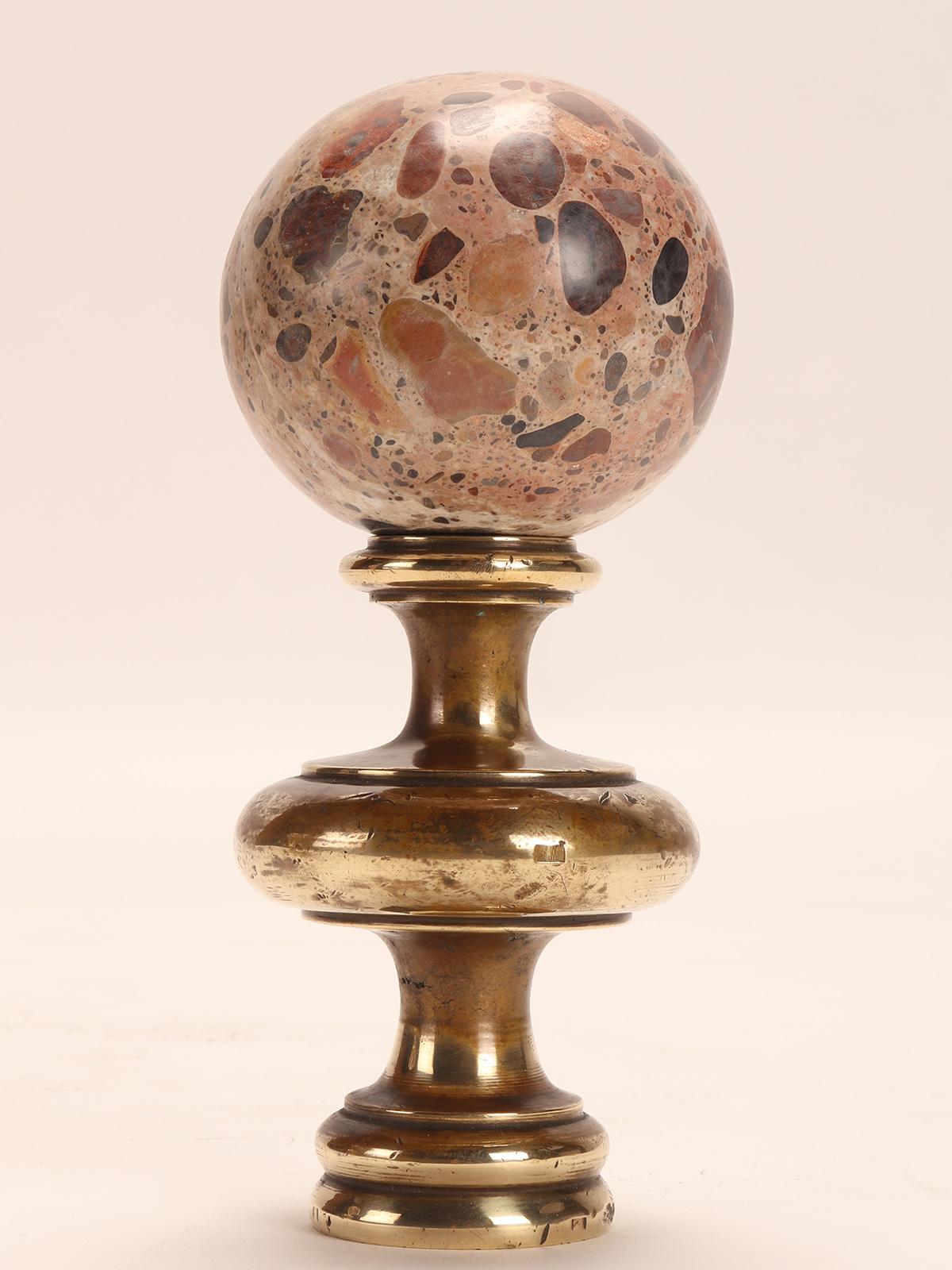 A Wunderkammer Grand Tour's souvenir> A pair of breccia marble spheres, resting on a base, made of brass. Italy circa 1870.
