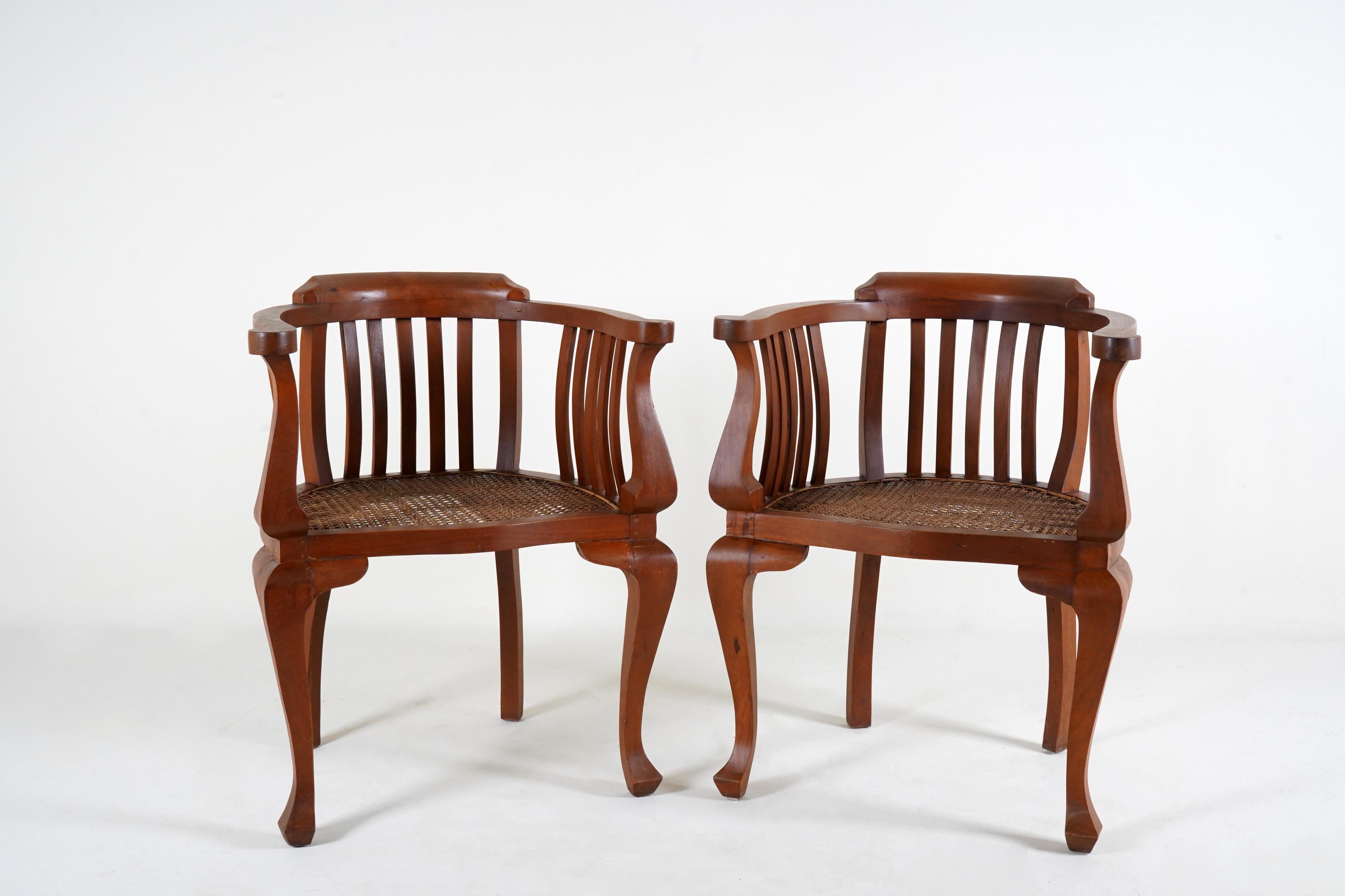 Burmese A Pair of British Colonial Teak Arm Chairs With Rattan Seats