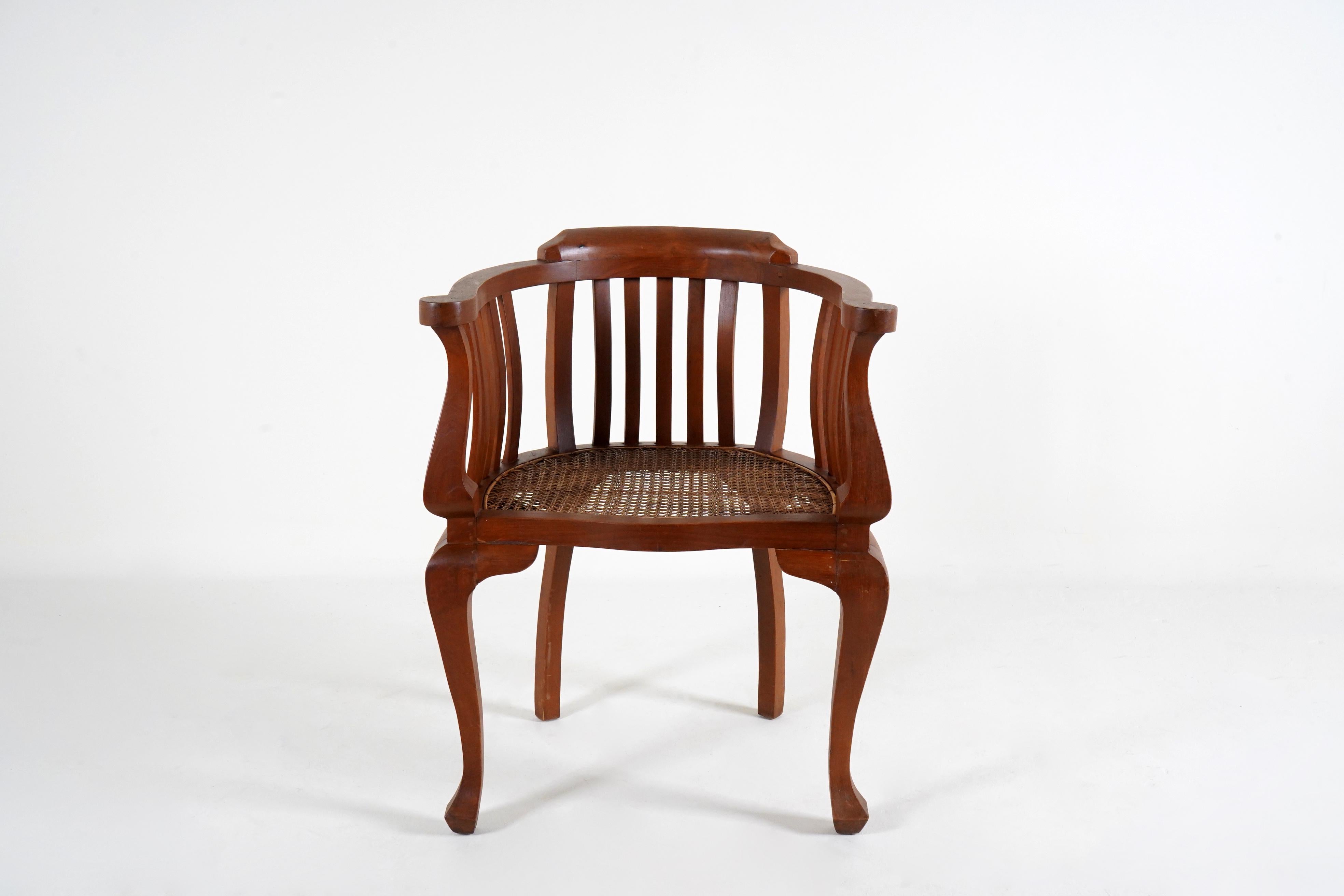 20th Century A Pair of British Colonial Teak Arm Chairs With Rattan Seats