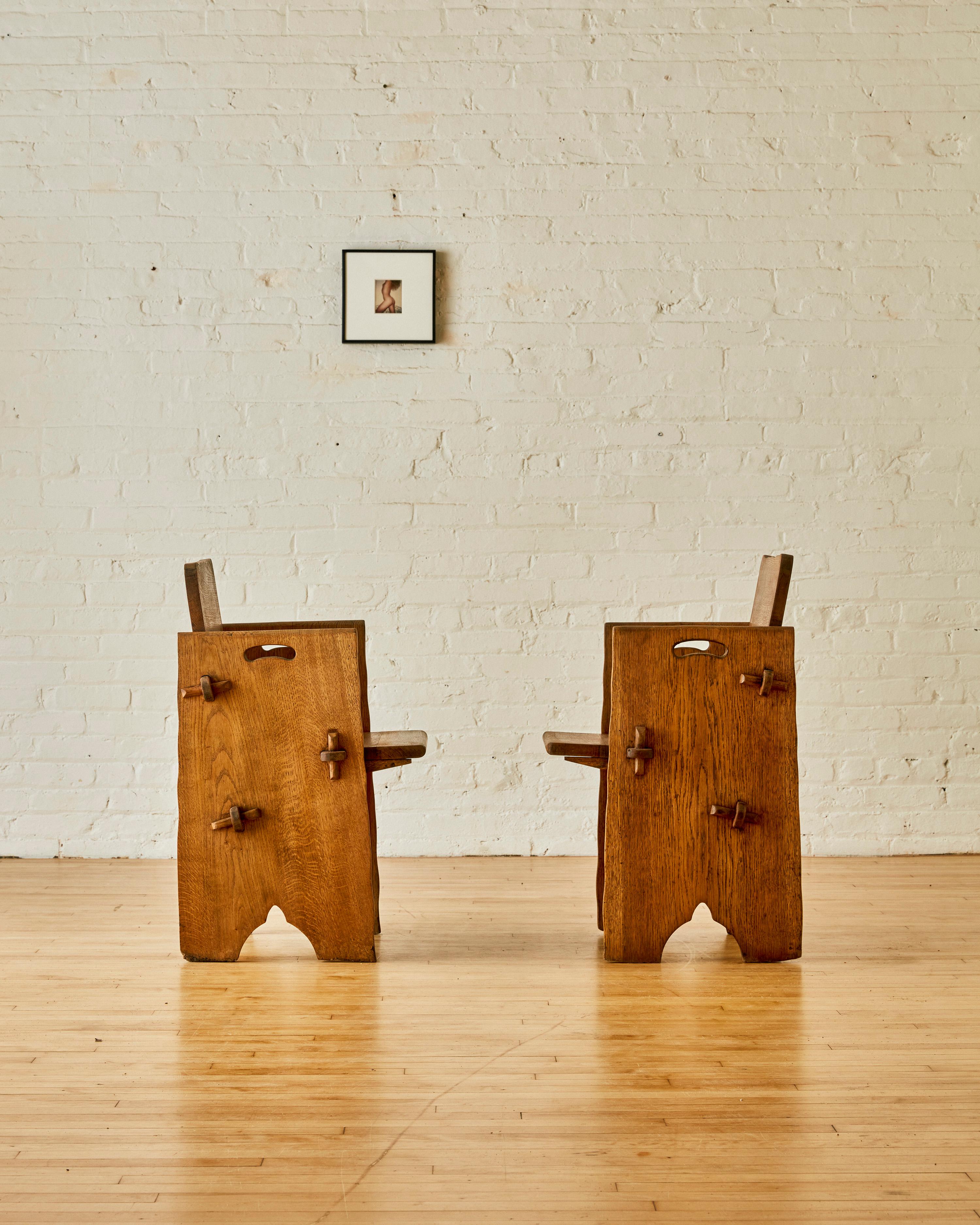 Mid-Century Modern A Pair of British Scalloped Edge Oak Pegged Chairs.  For Sale