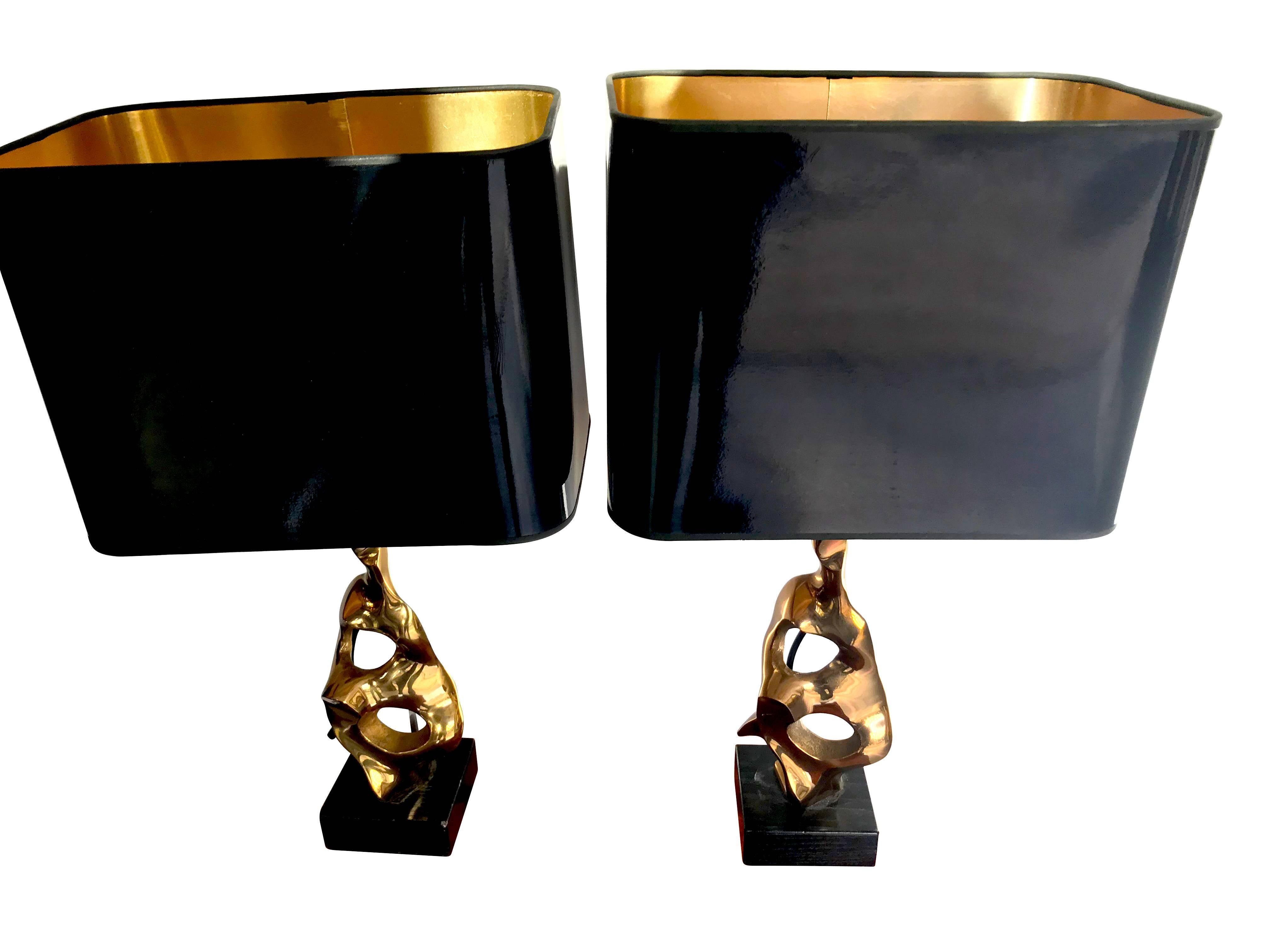 A pair of bronze, abstract, sculptural lamps by Michel Jaubert, signed on the base of each sculpture 