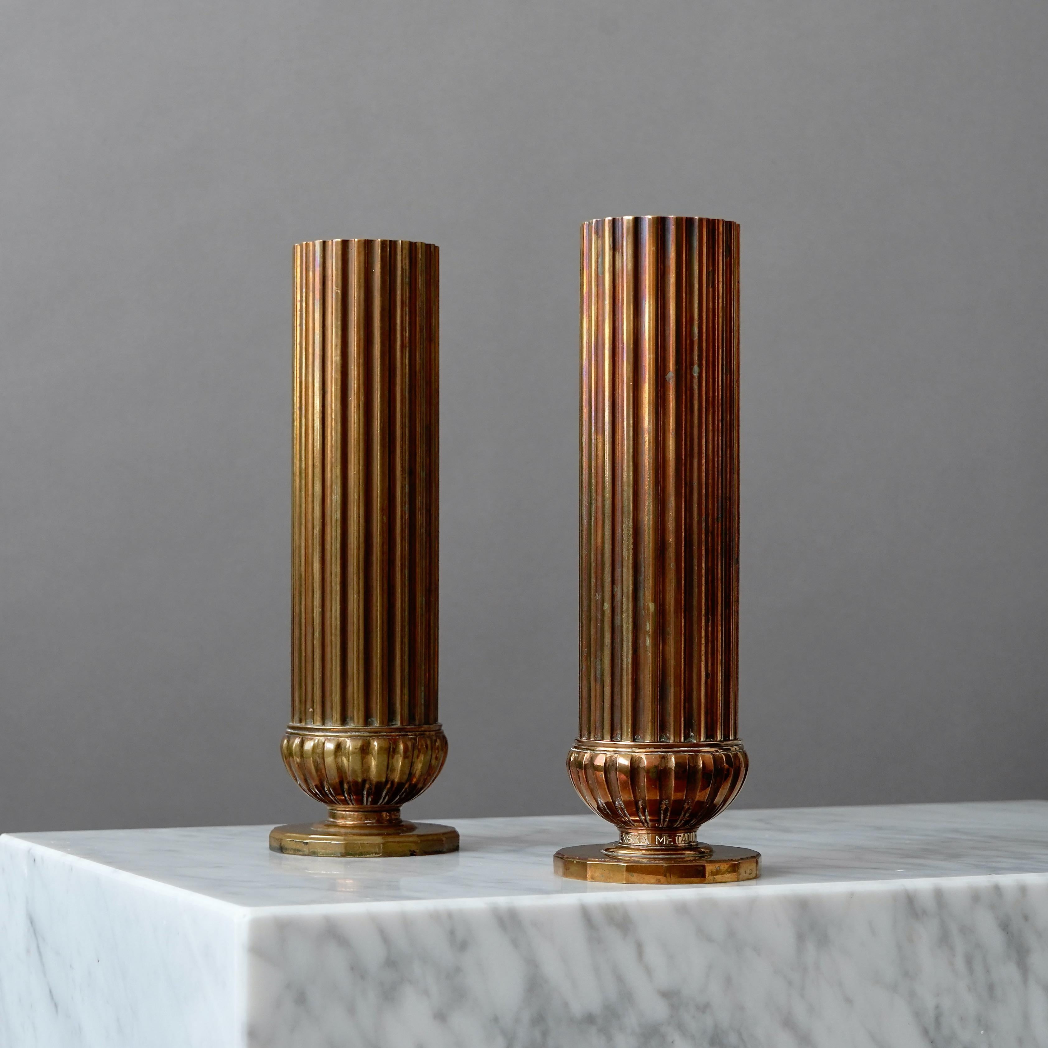 A pair of beautiful art deco bronze vases with amazing patina. 
Made by SVM, Svenska Metallverken AB, Sweden, 1930s.  

Great condition, but with inscriptions on the bases.
Stamped 'SVENSKA METALLVERKEN'.