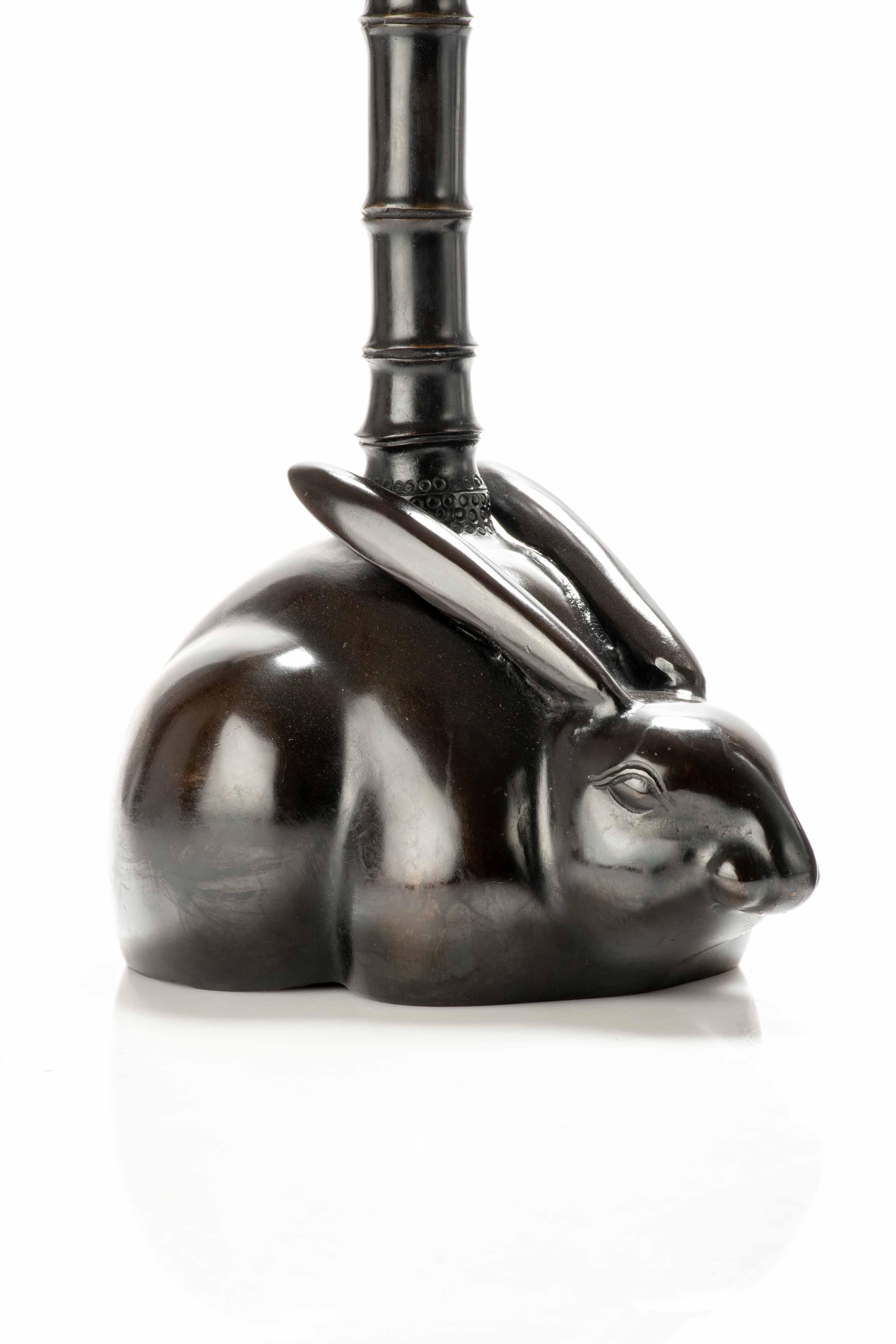 Pair of bronze candlesticks depicting two rabbits holding a bamboo-shaped candle stick.
The rabbits are precisely depicted, highlighting their distinctive features such as long ears, soft faces and elegant stances.

Period: Taisho 1920