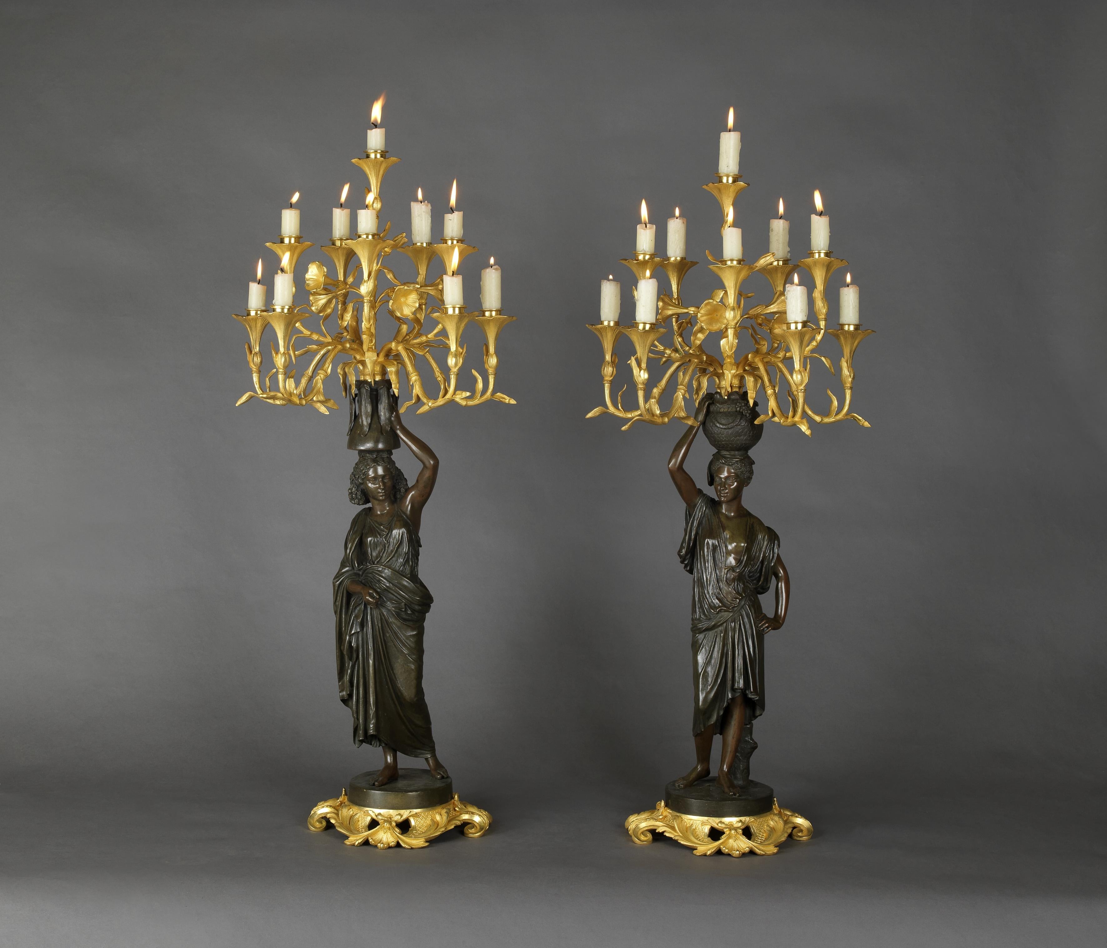 A pair of gilt and patinated bronze figural candelabra by Charles Cumberworth.

French, circa 1850. 

Signed 'C. Cumberworth'. 

This Fine pair of candelabra is finely modelled as a North African figures of a man and woman with flowing drapery